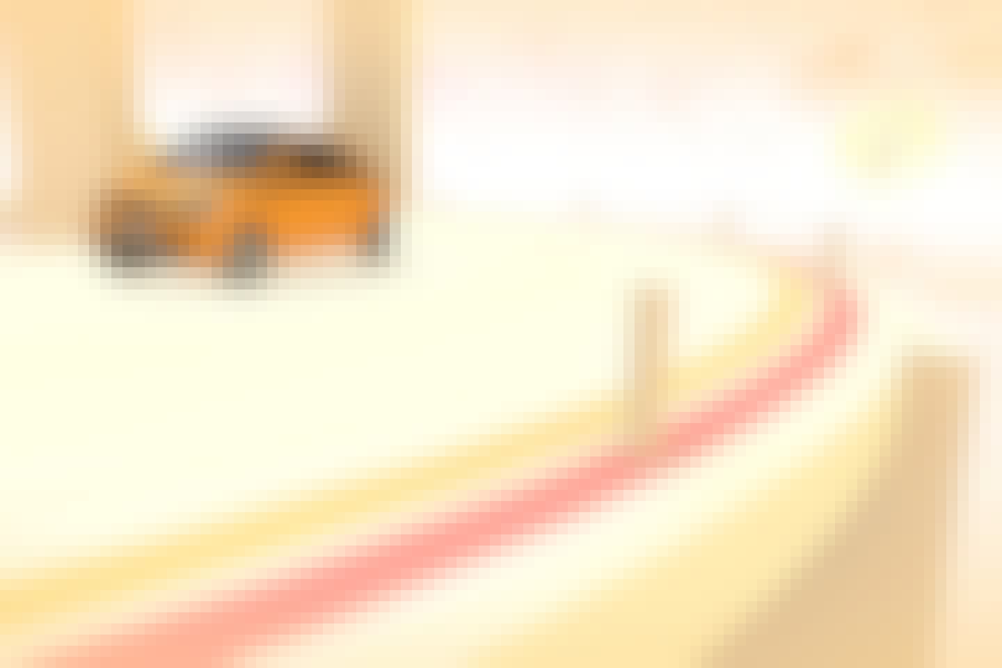 Orange Renault Twingo driving, view from the side