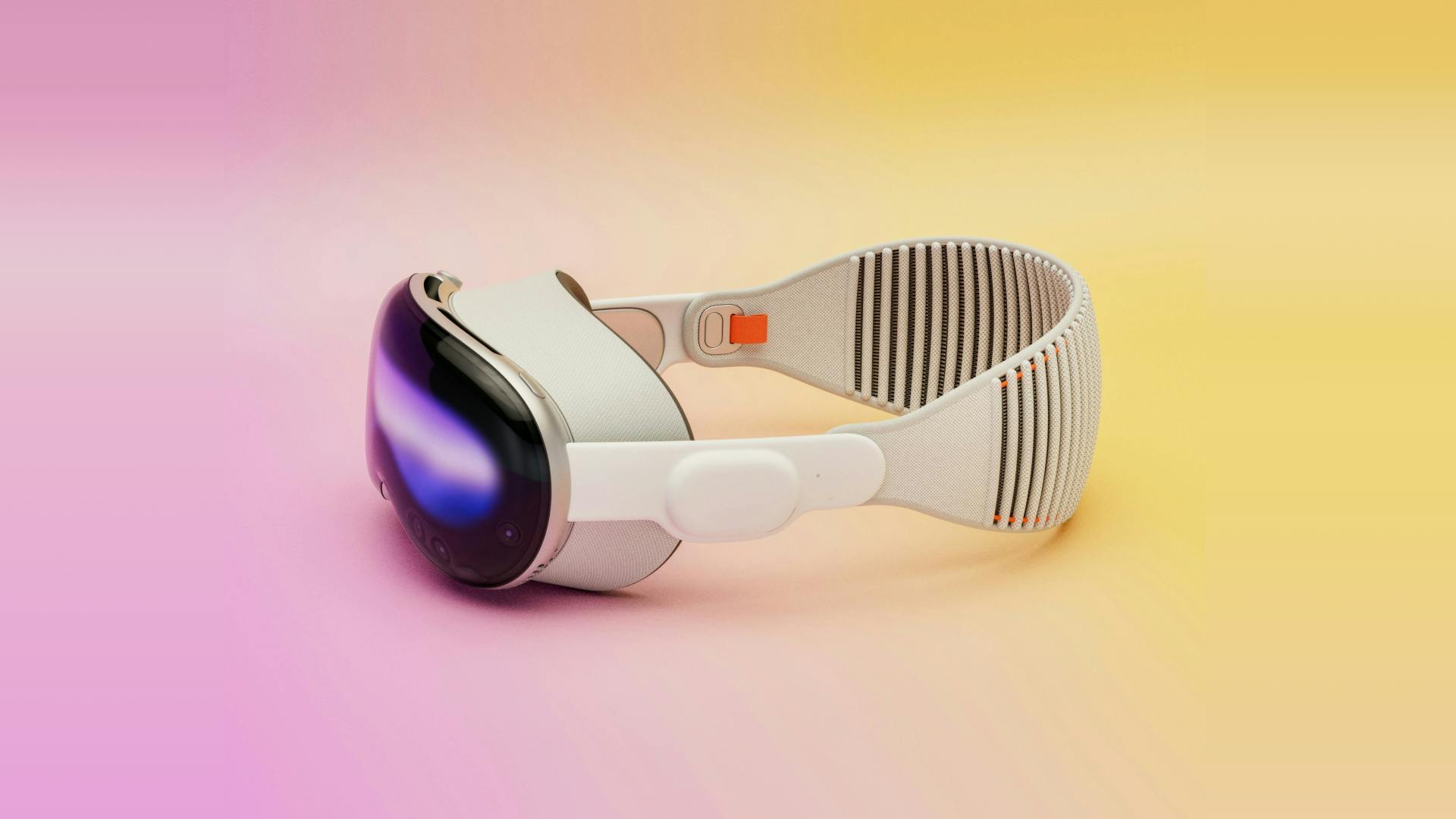 This is a 3D illustration of a VR headset. It looks like it's turned on as we can see colors on the screen. The background is a pastel gradient color from pink to yellow.