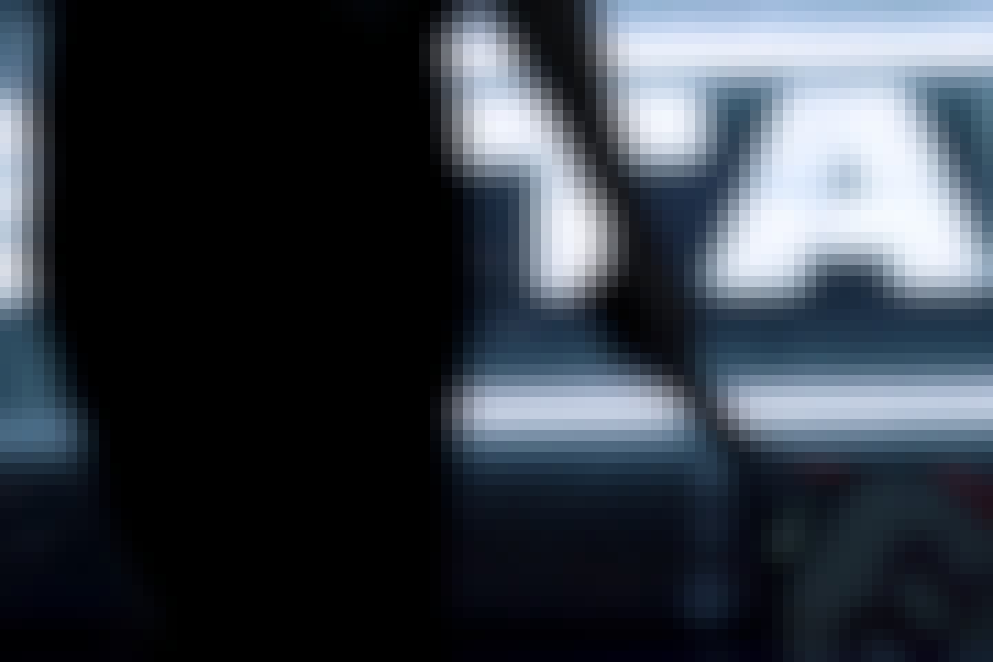 From behind, someone is holding a tennis racket.