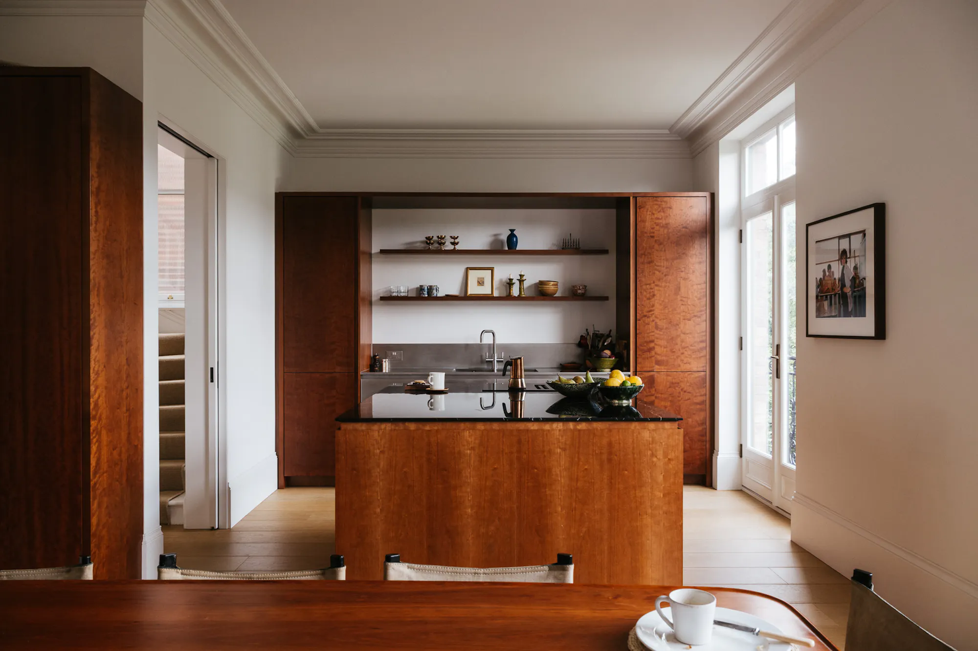 Cherry timber, black marble and stainless steel Ma-kon kitchen.