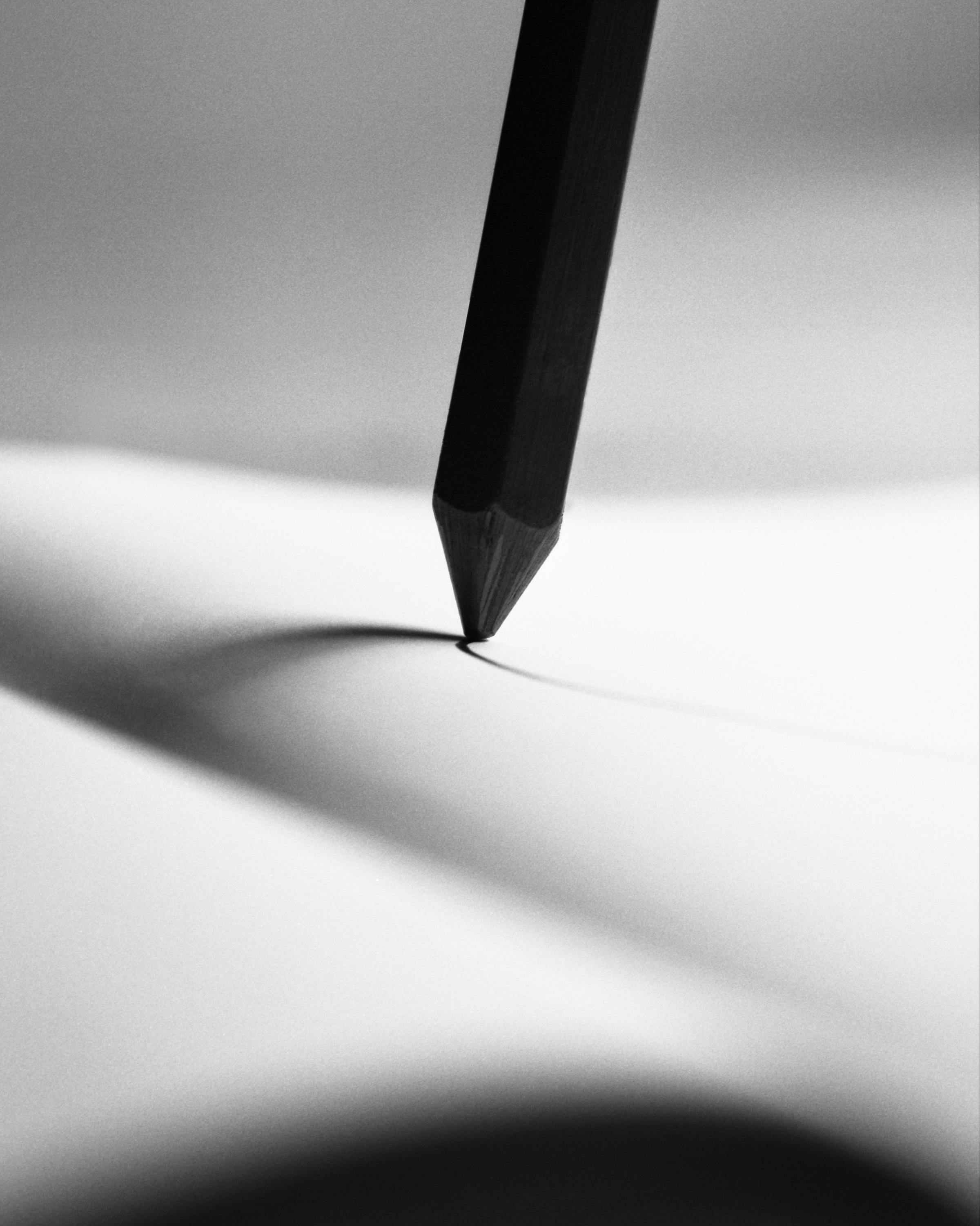 Black and white photograph of a pencil drawing in a notebook.