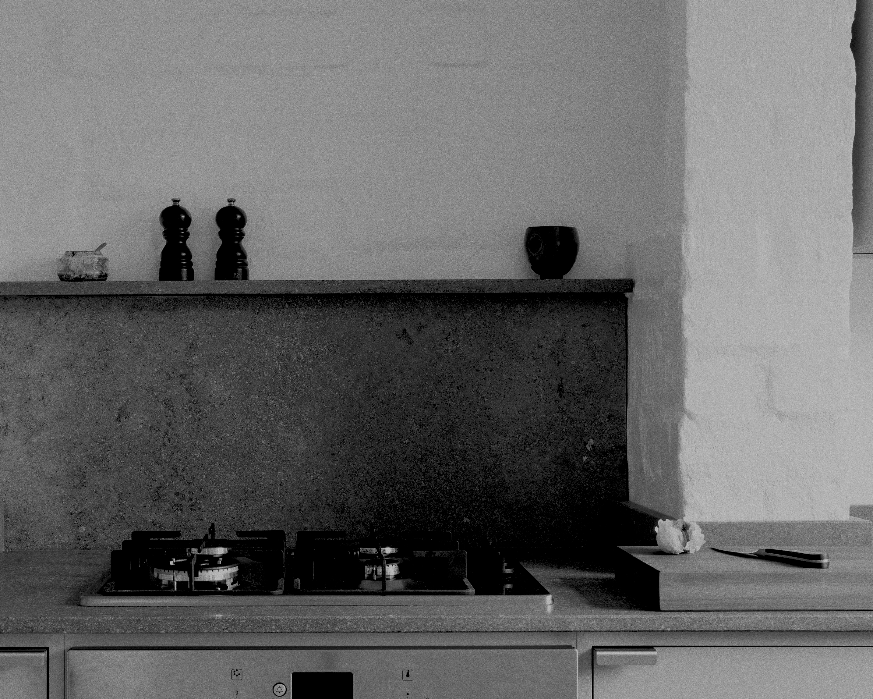 Minimal warm grey painted Ma-kon kitchen with limestone worktops.