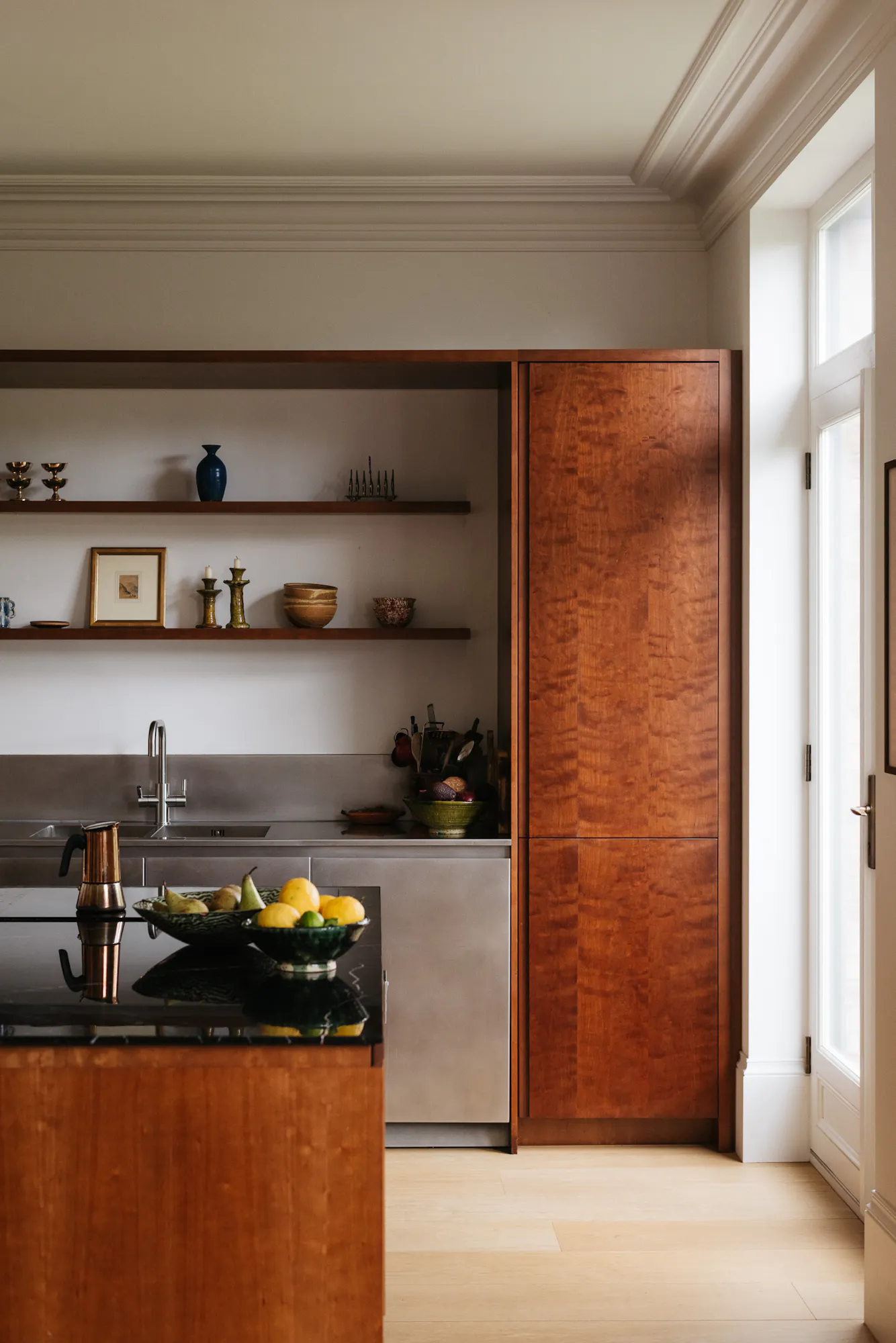 Cherry timber, black marble and stainless steel Ma-kon kitchen.