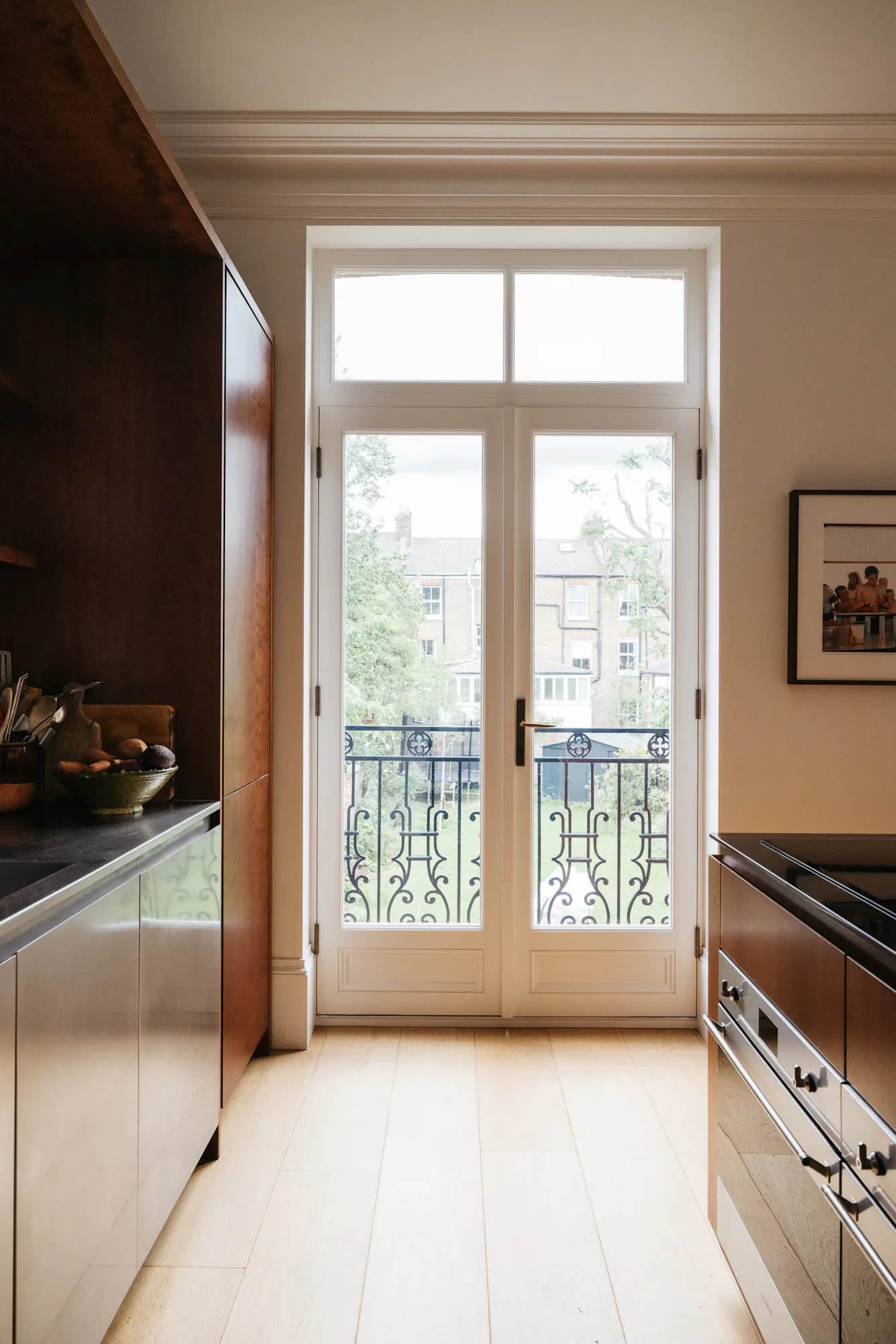 Cherry timber, black marble and stainless steel Ma-kon kitchen.