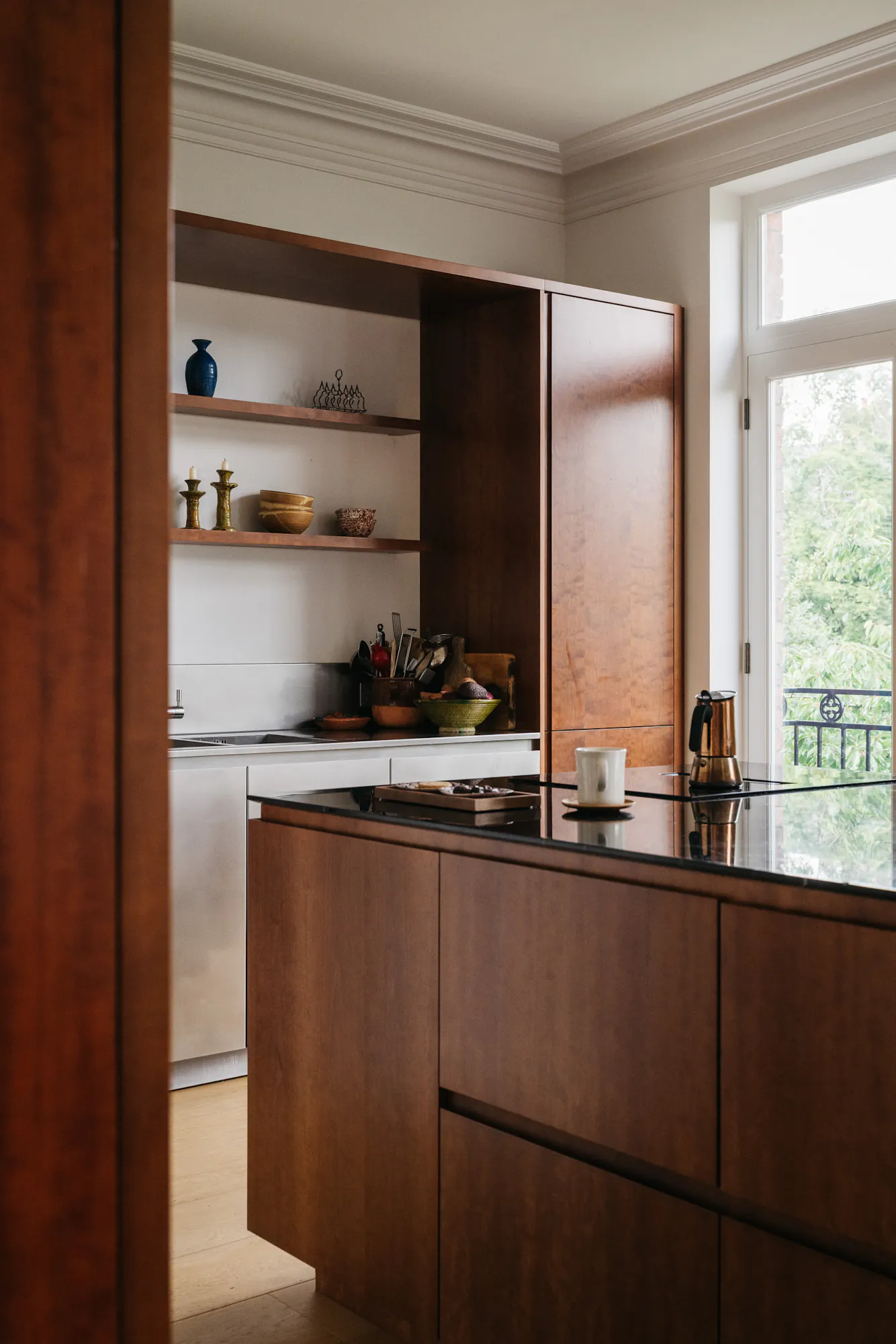 Cherry timber, black marble and stainless steel Ma-kon kitchen.