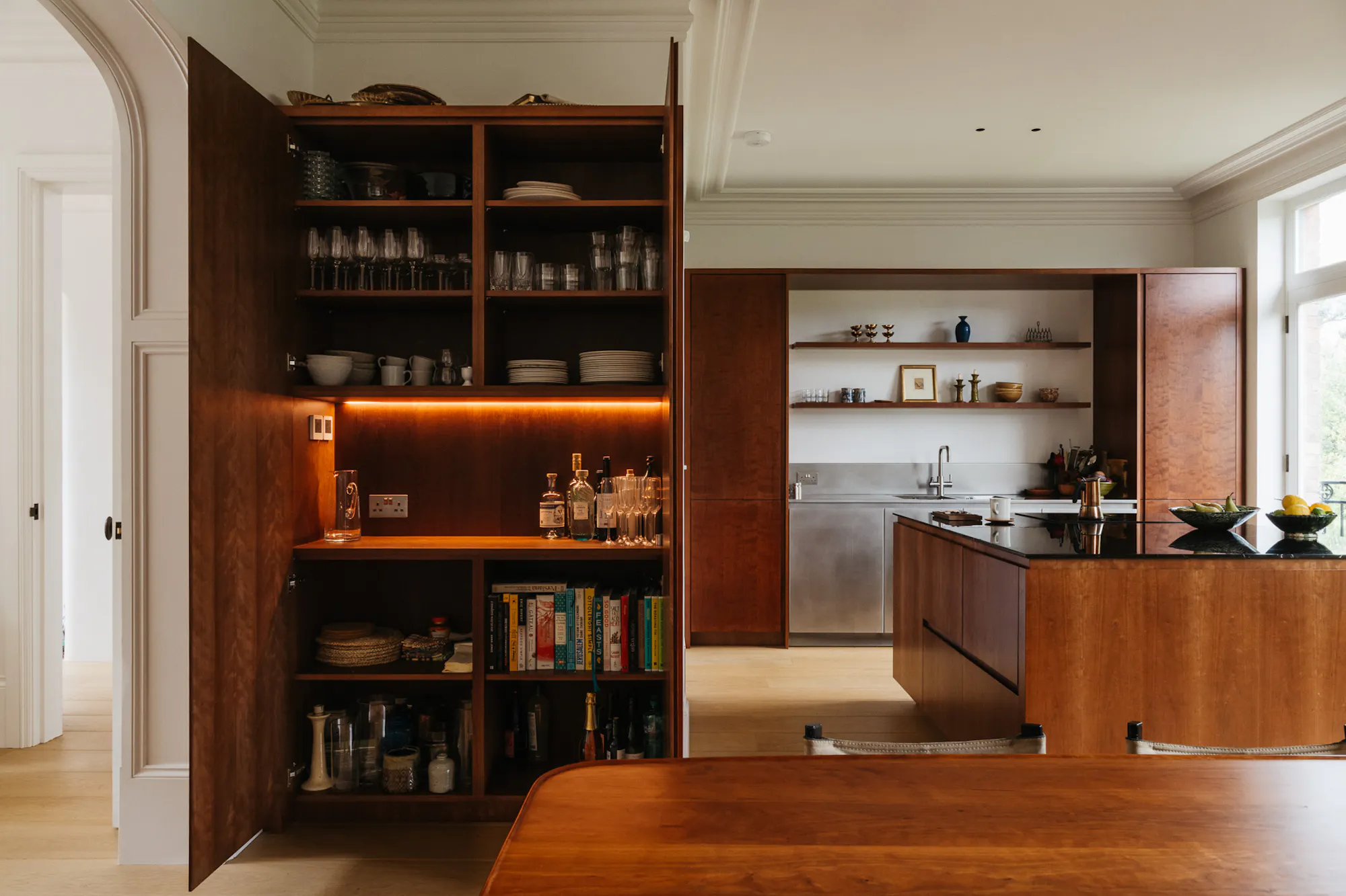 Cherry timber, black marble and stainless steel Ma-kon kitchen.