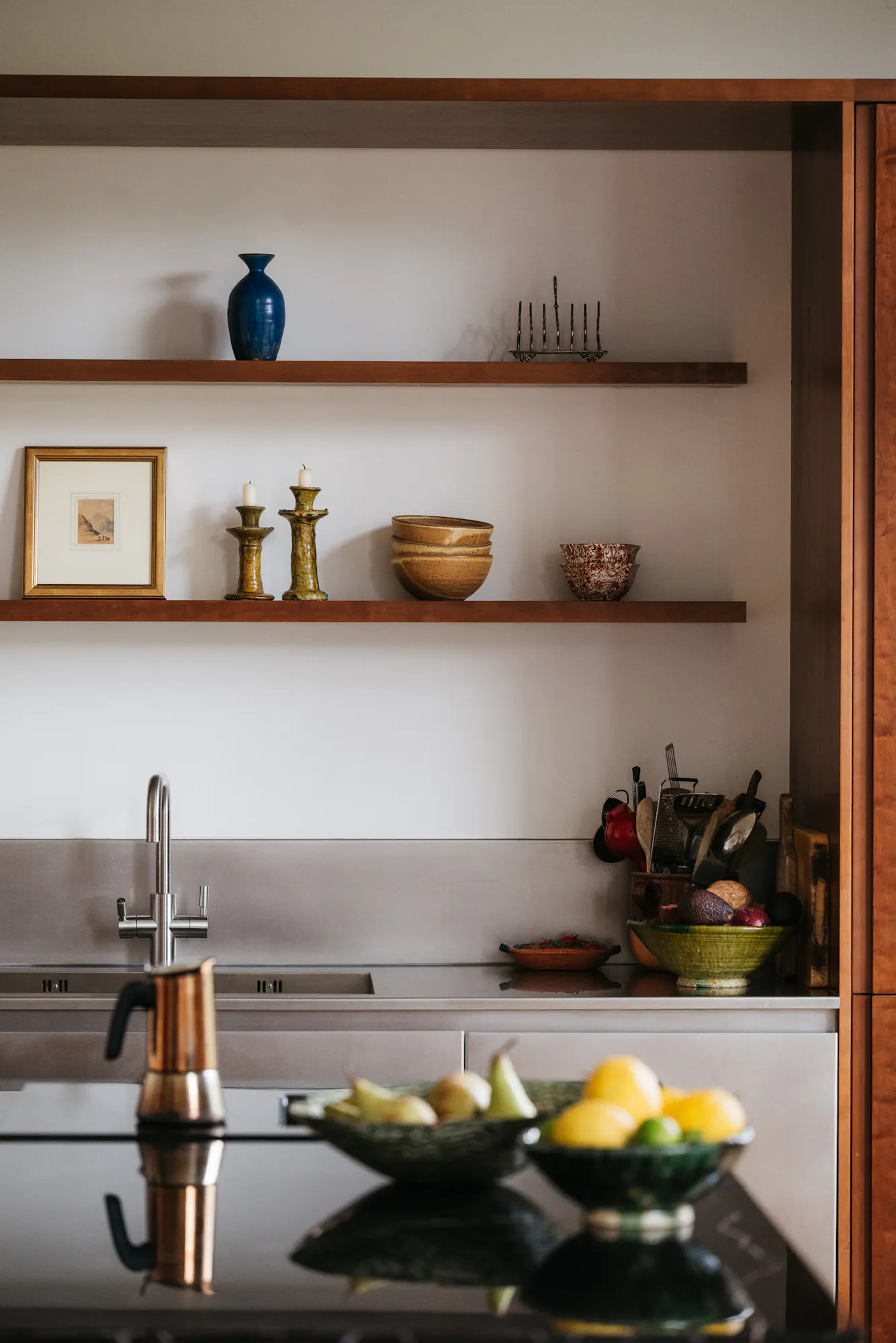 Cherry timber, black marble and stainless steel Ma-kon kitchen.