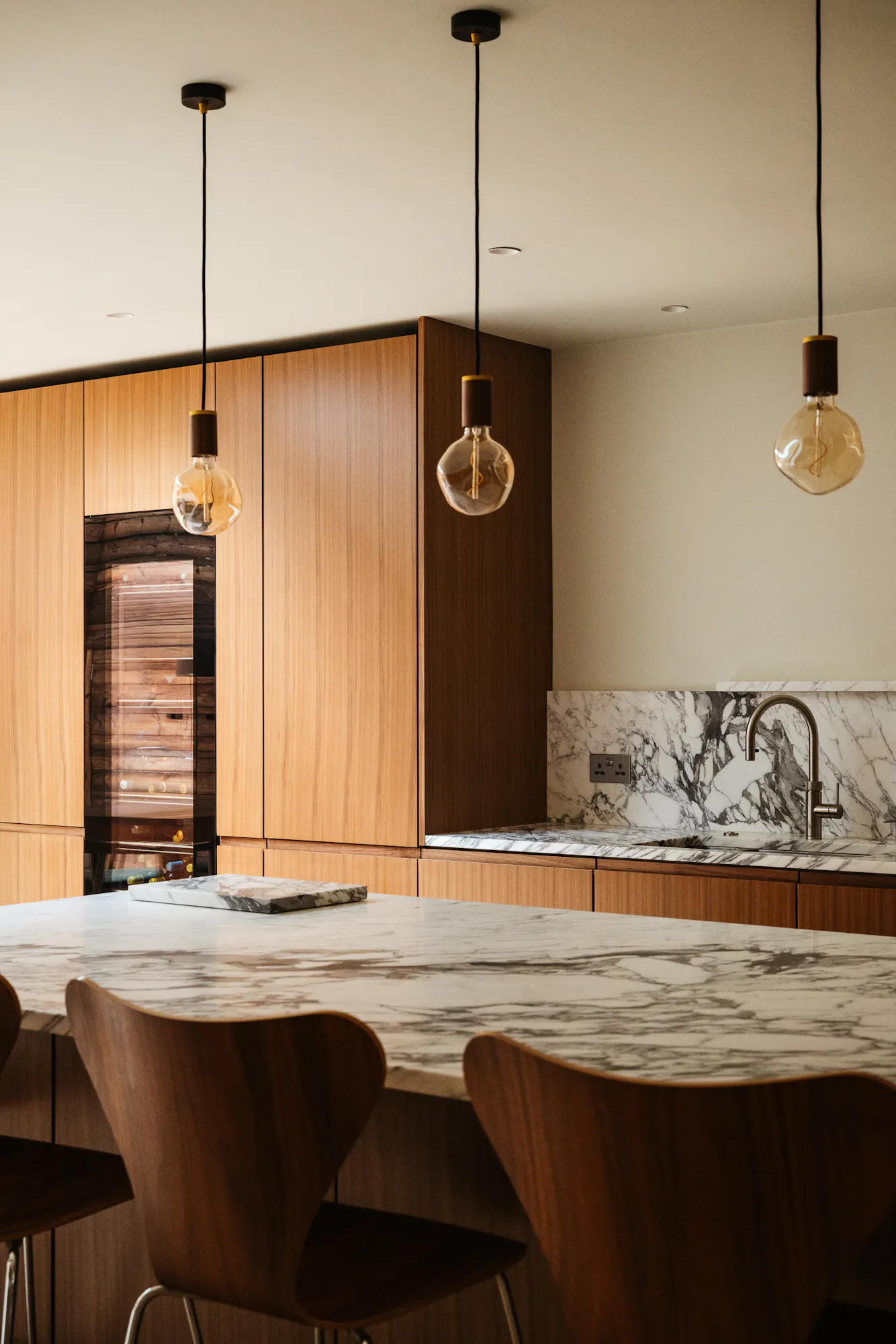Walnut timber and marble Ma-kon kitchen.