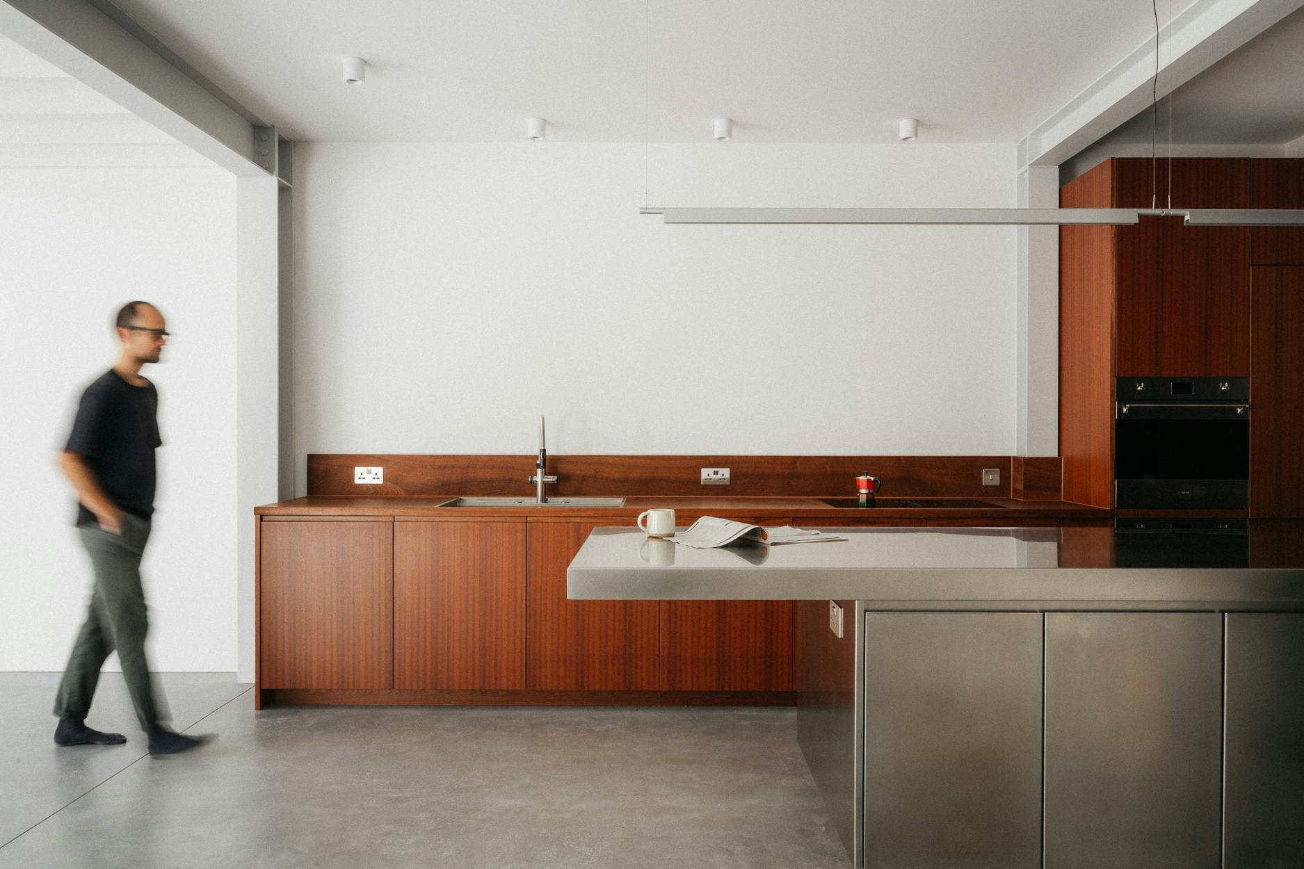 Contemporary sapele and stainless steel Ma-kon kitchen.