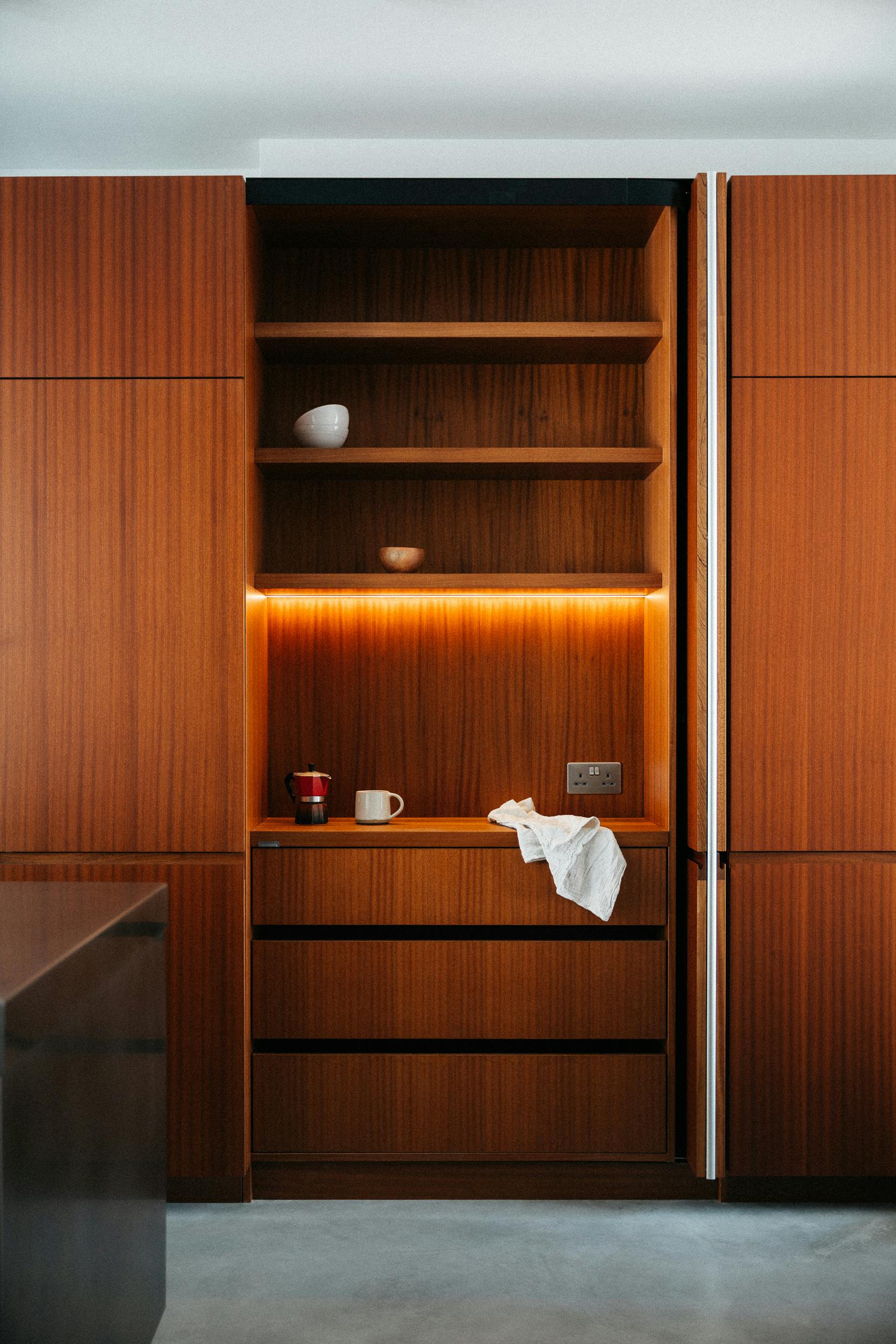 Contemporary sapele and stainless steel Ma-kon kitchen.