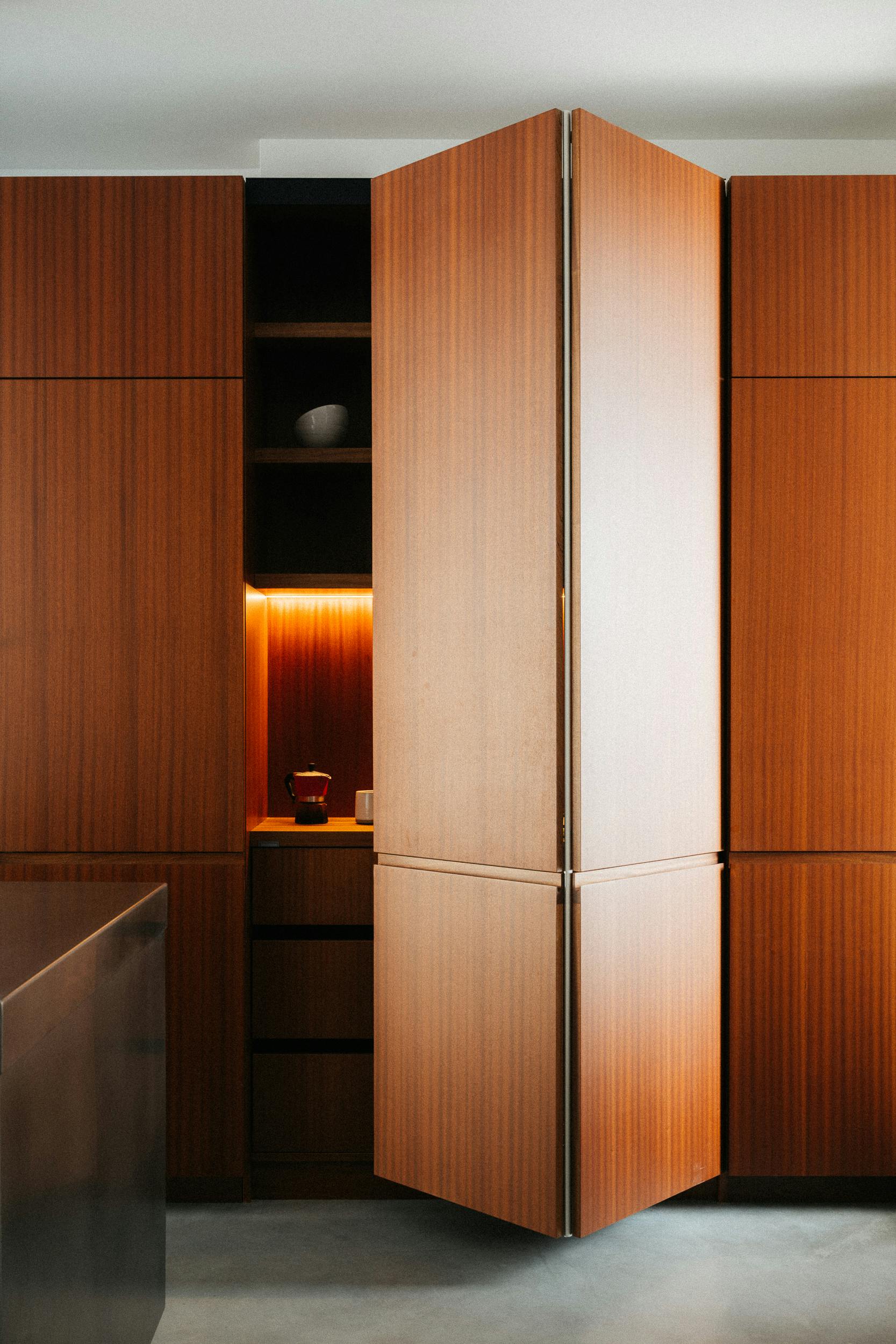 Contemporary sapele and stainless steel Ma-kon kitchen.