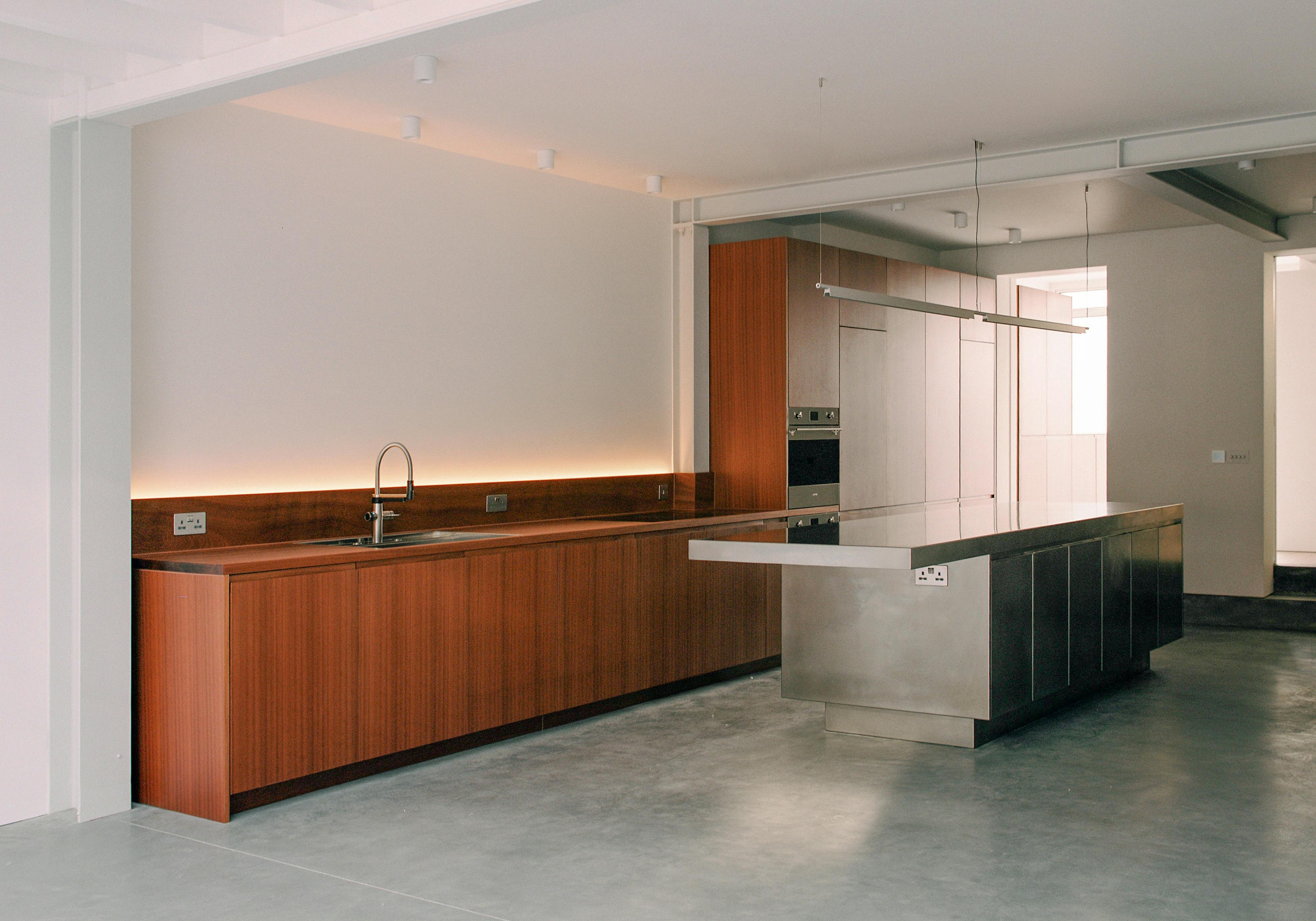 Contemporary sapele and stainless steel Ma-kon kitchen.