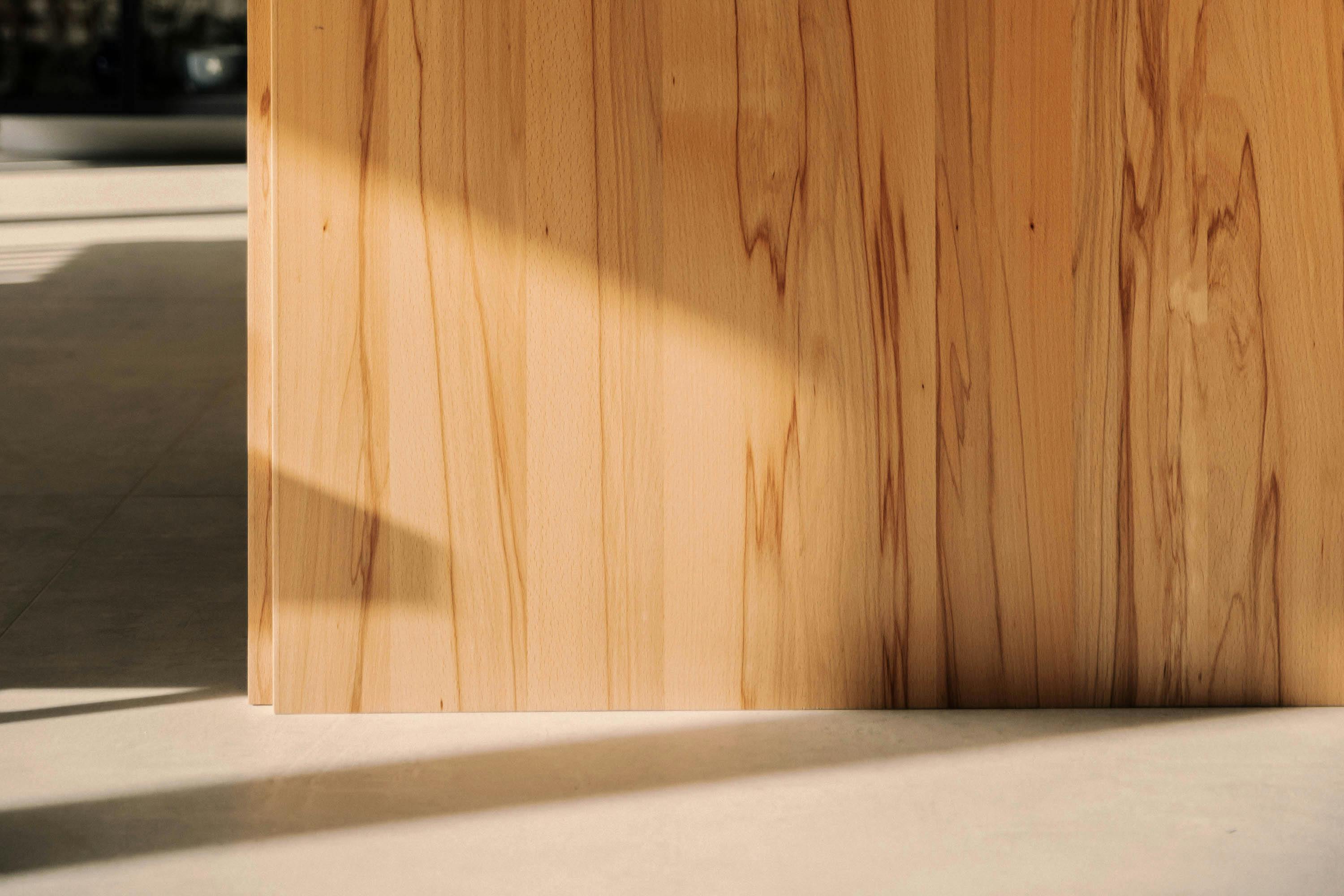 Contemporary wooden Ma-kon kitchen with limestone worktop in Northumberland.