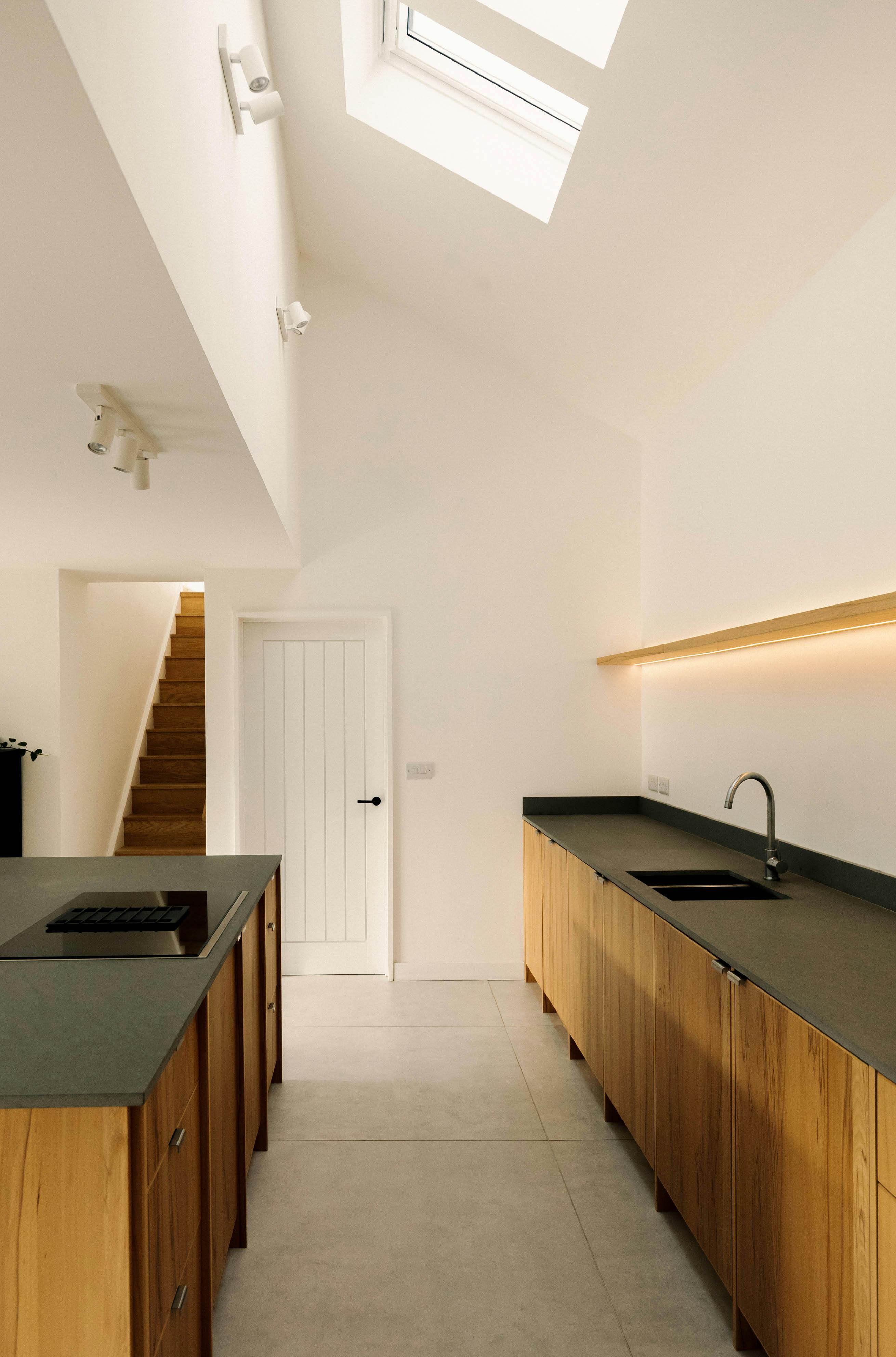 Contemporary wooden Ma-kon kitchen with limestone worktop in Northumberland.