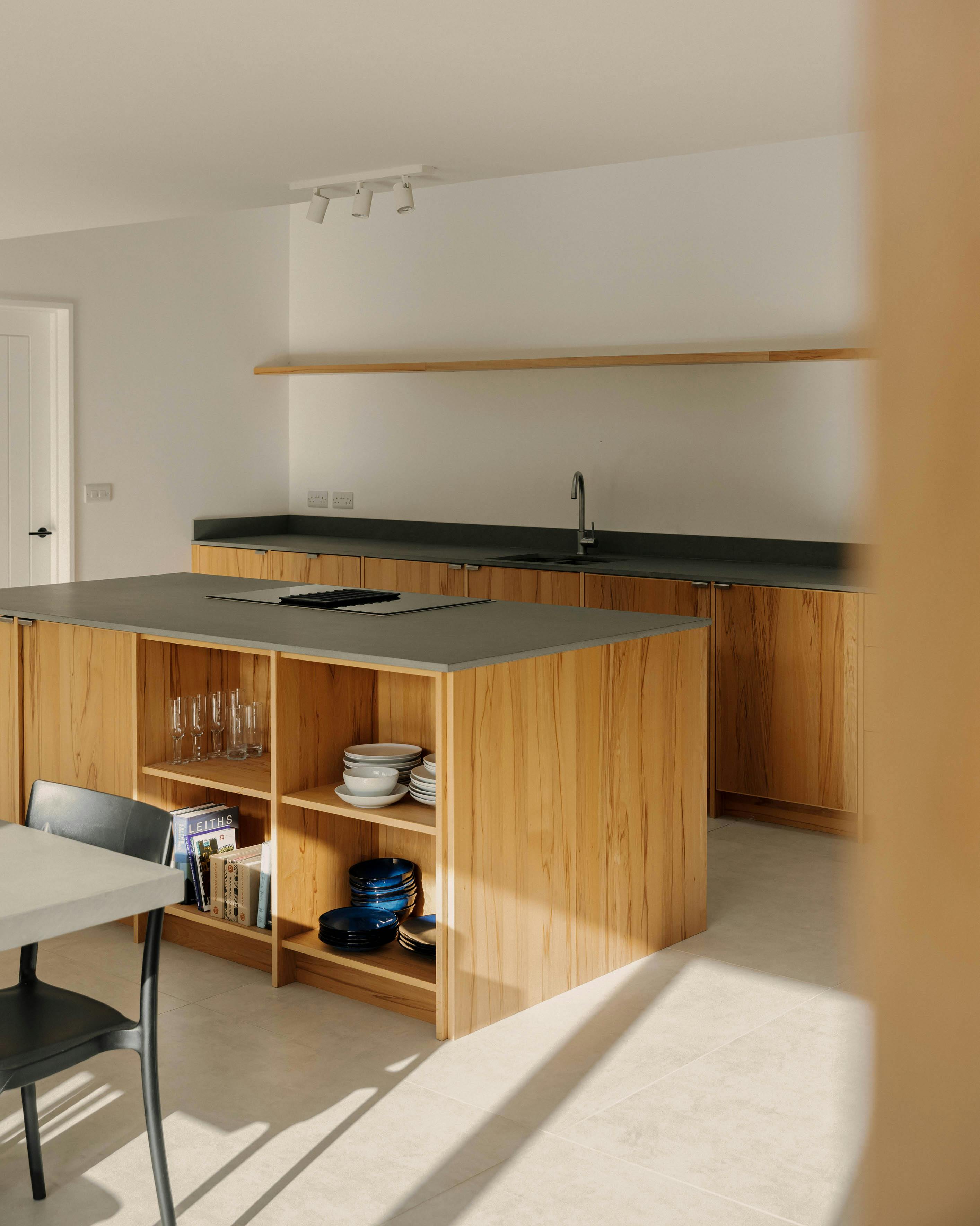 Contemporary beech timber and limestone Ma-kon kitchen.