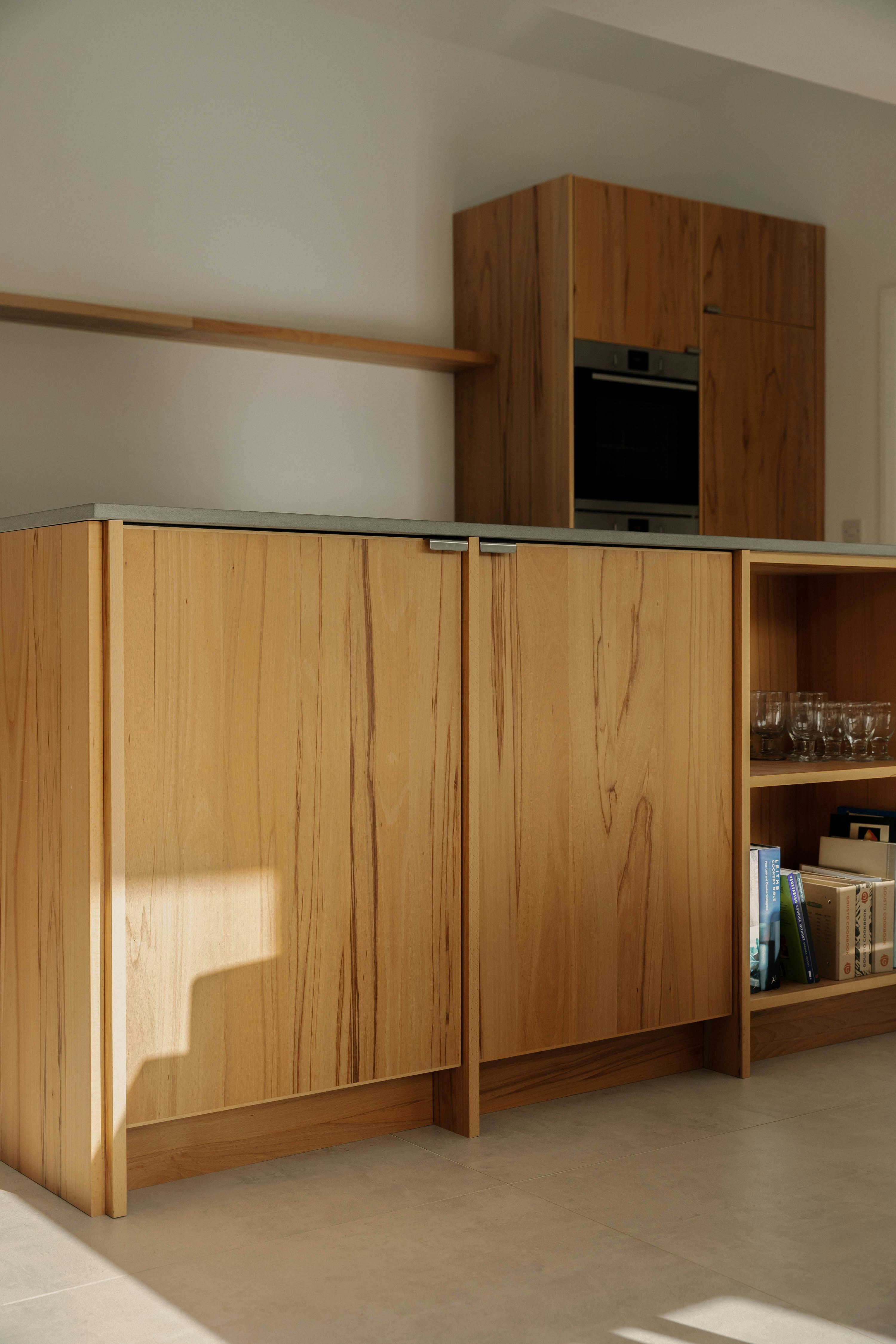 Contemporary wooden Ma-kon kitchen with limestone worktop in Northumberland.