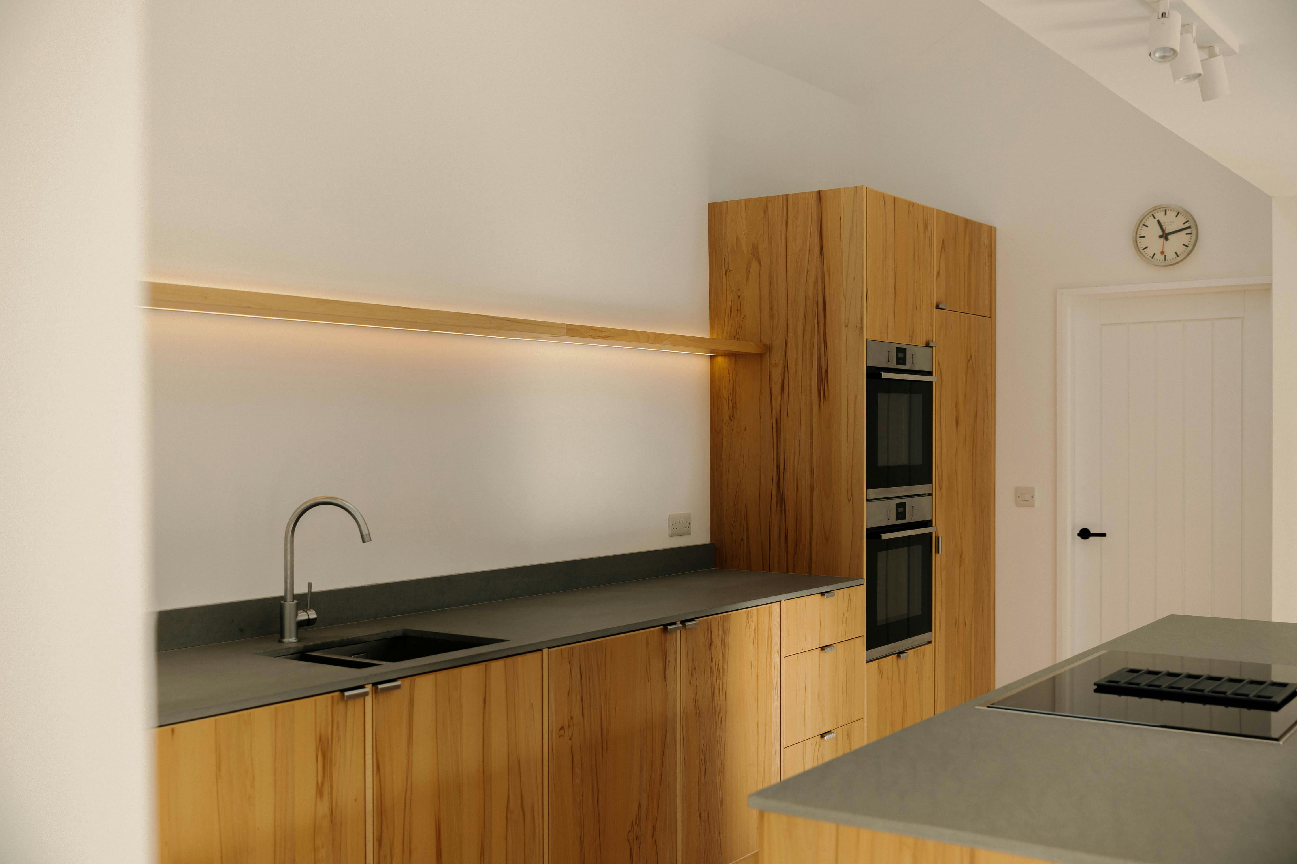 Contemporary wooden Ma-kon kitchen with limestone worktop in Northumberland.
