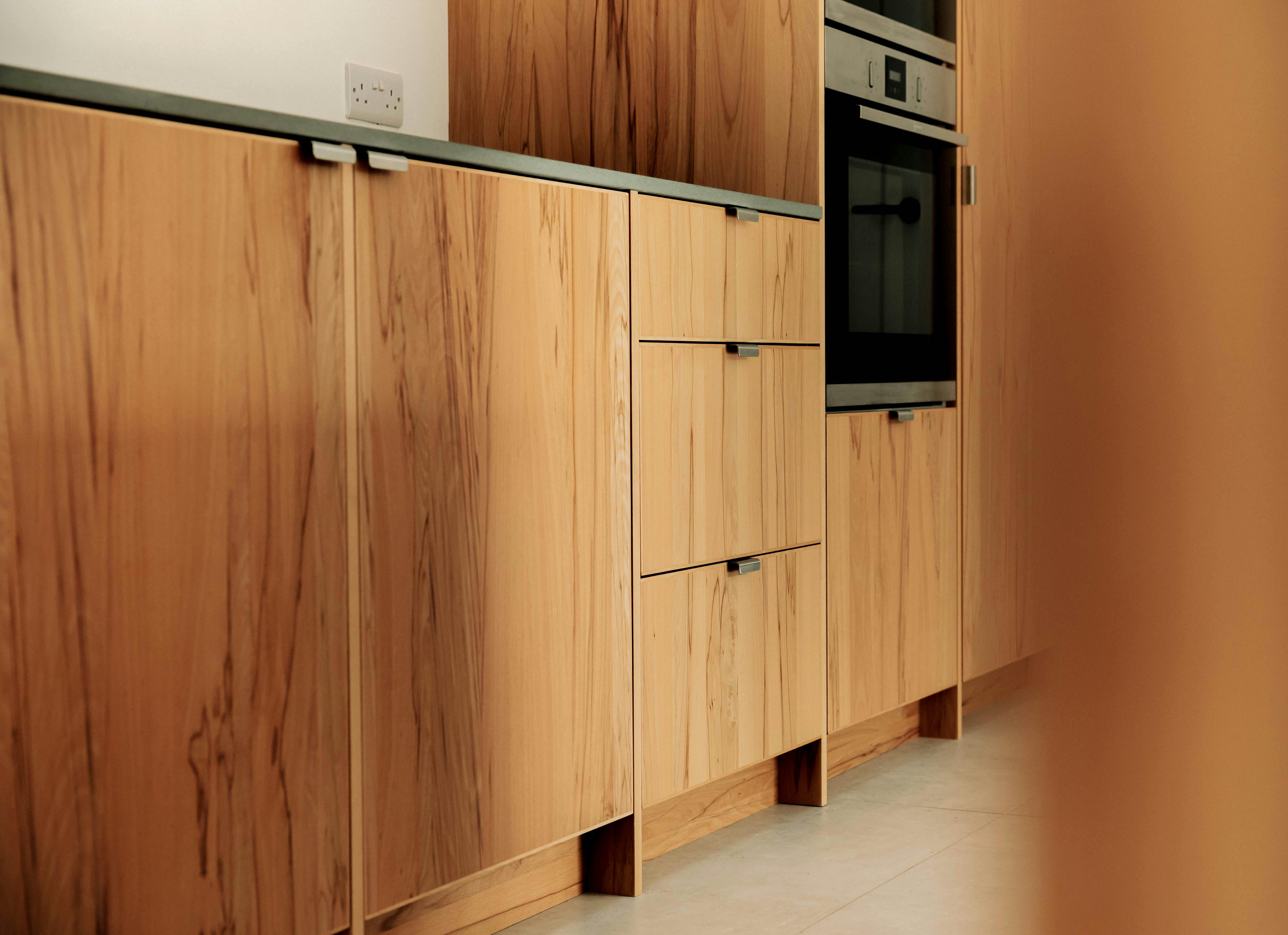 Contemporary wooden Ma-kon kitchen with limestone worktop in Northumberland.