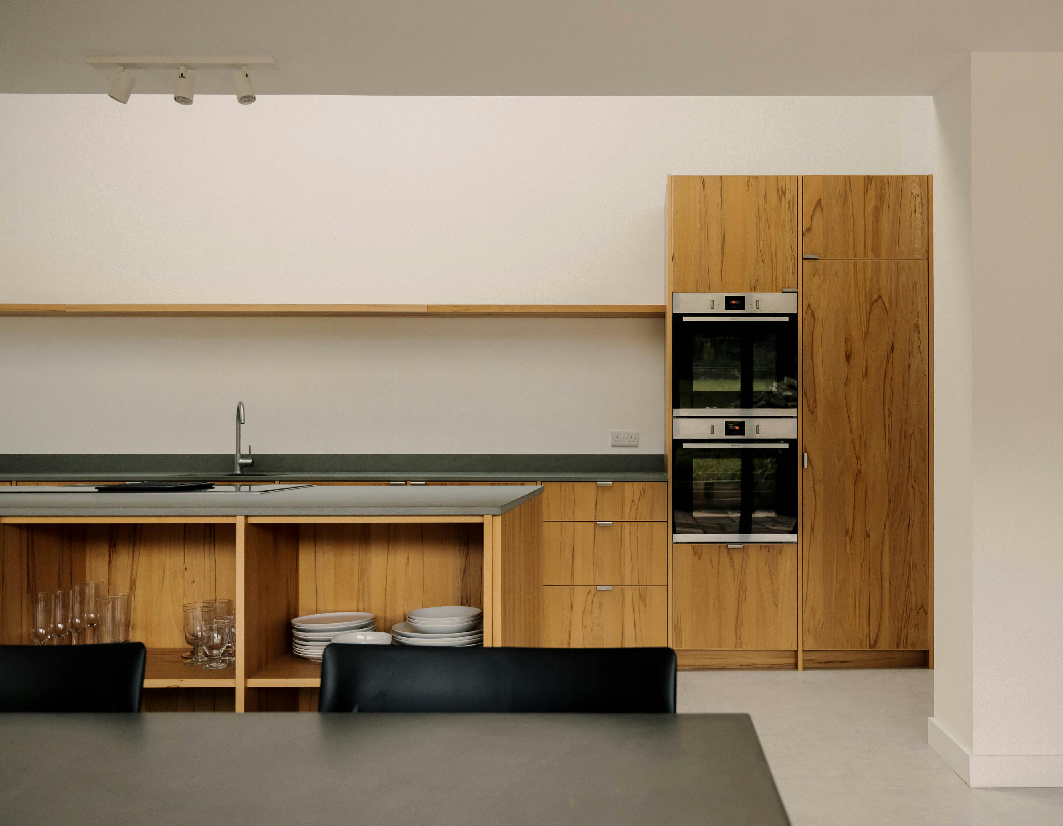 Contemporary wooden Ma-kon kitchen with limestone worktop in Northumberland.