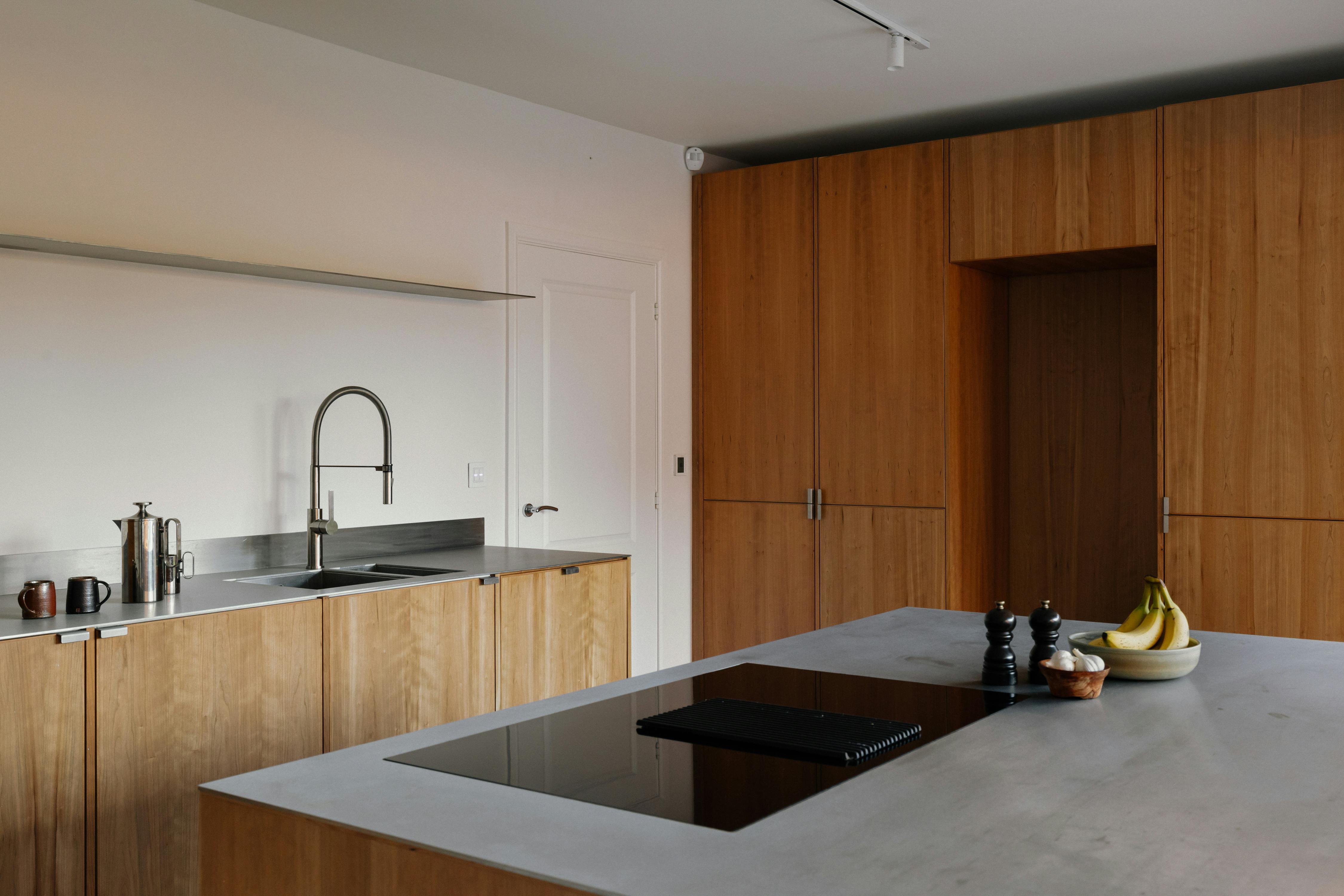 Contemporary cherry timber and stainless steel Ma-kon kitchen.