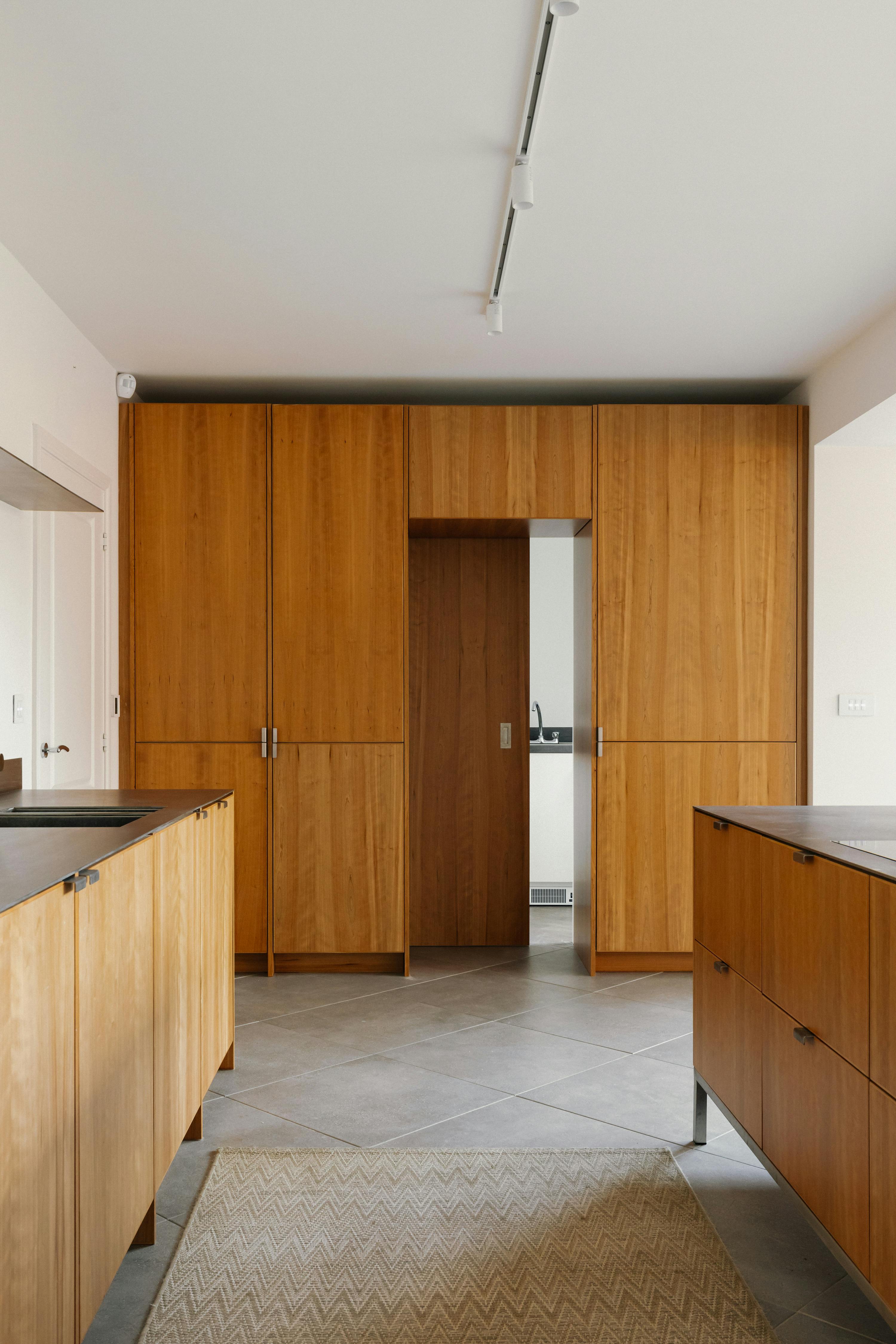 Contemporary cherry timber and stainless steel Ma-kon kitchen.