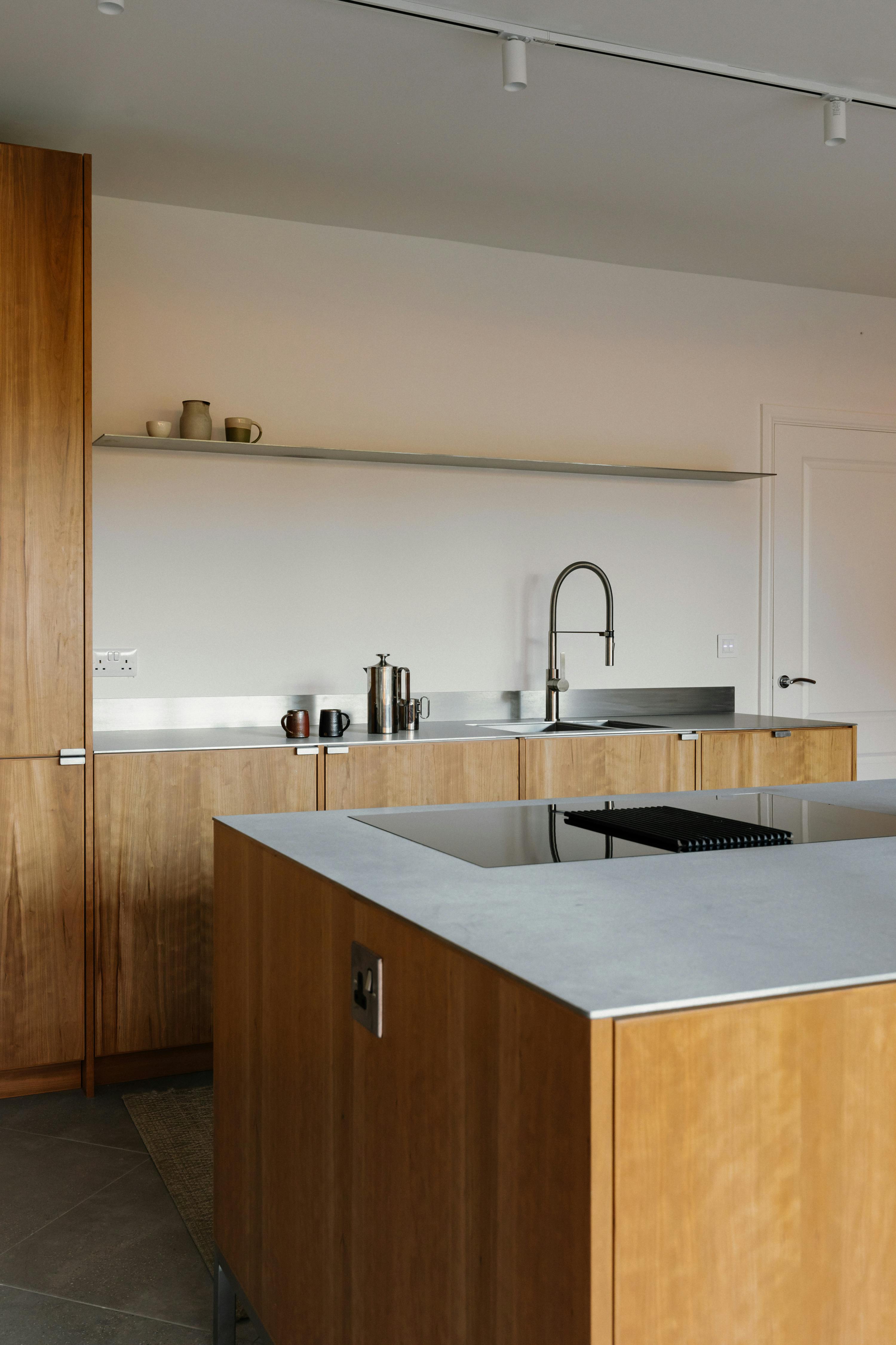 Contemporary cherry timber and stainless steel Ma-kon kitchen.