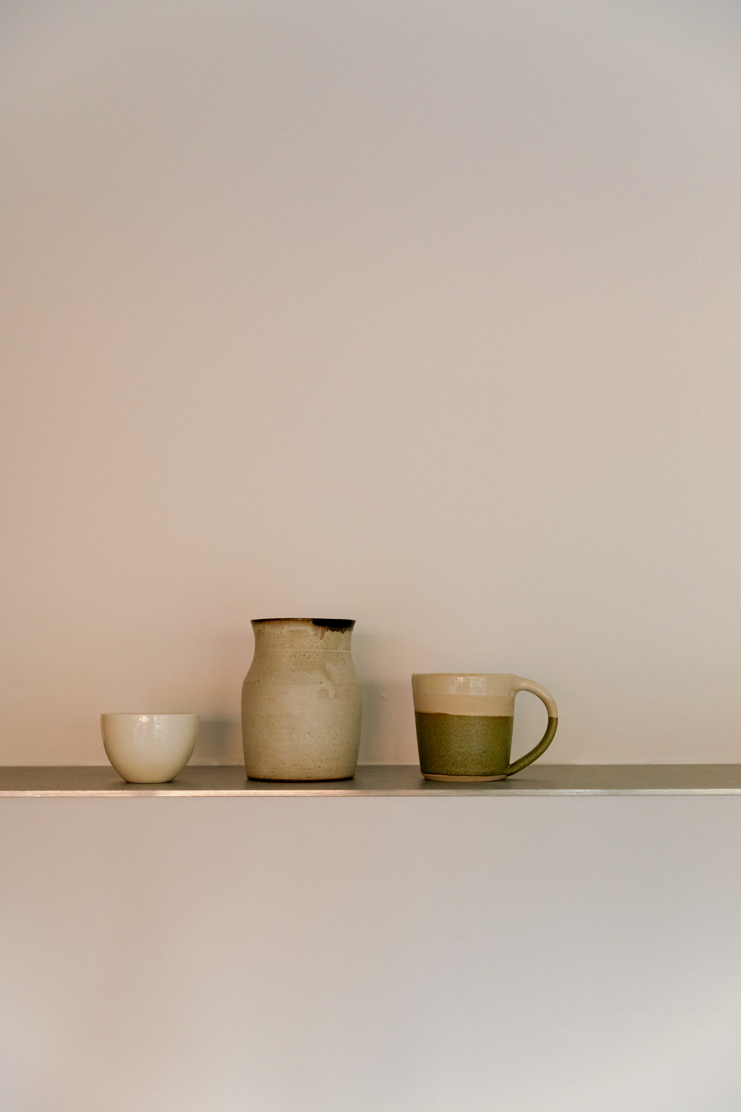 Contemporary cherry timber and stainless steel Ma-kon kitchen.