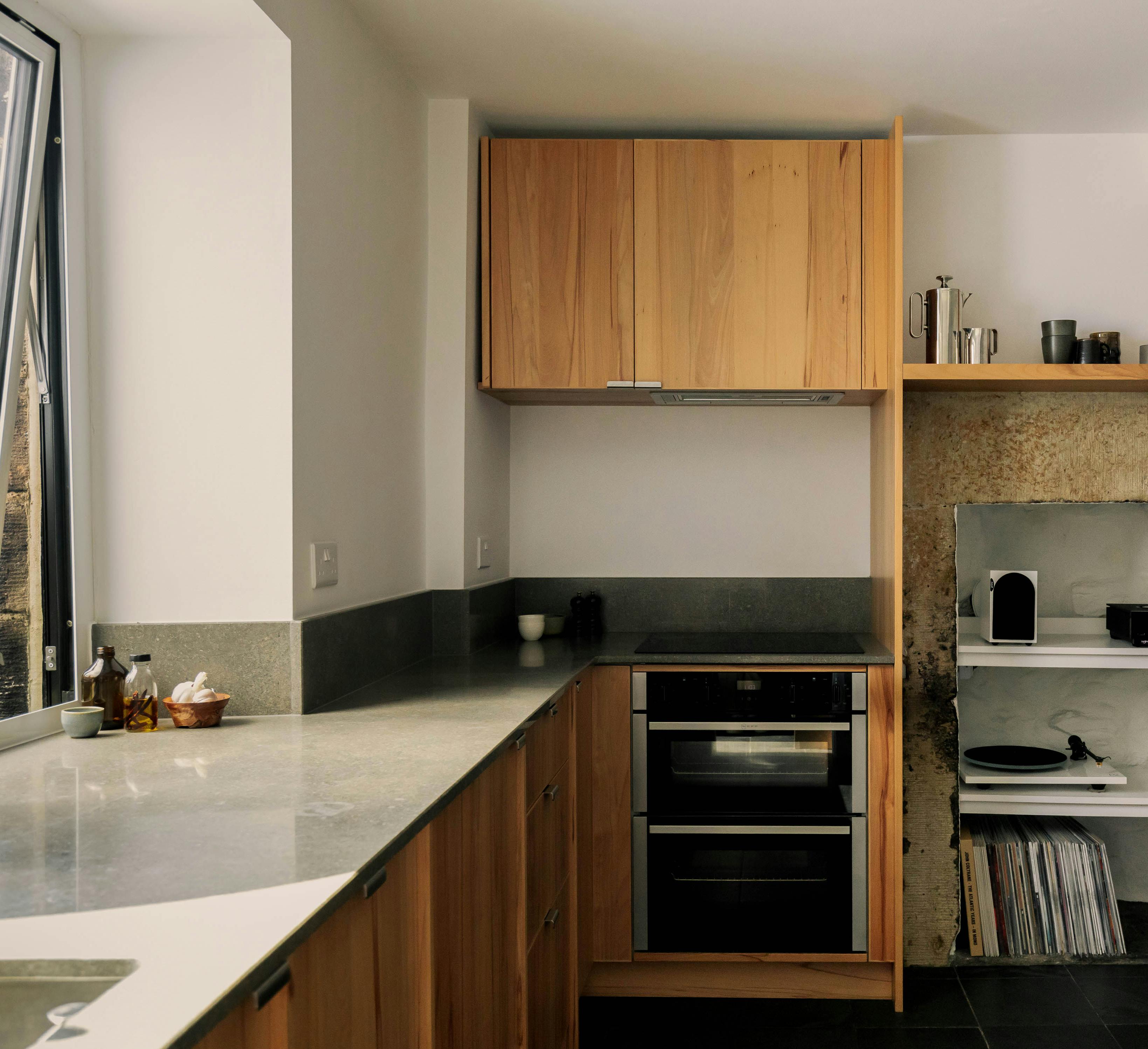 Contemporary wooden Ma-kon kitchen with limestone worktop in Leeds.