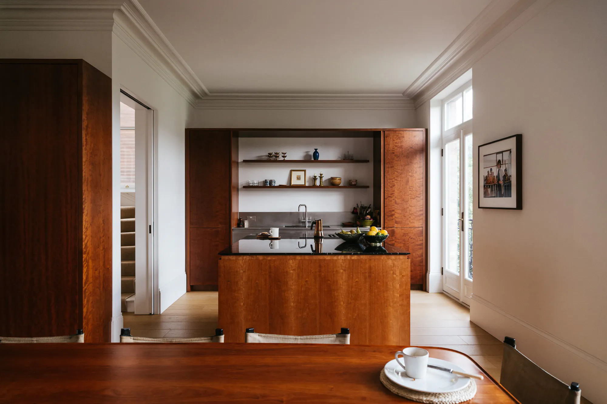 Cherry timber, stainless steel and black marble Ma-kon kitchen.