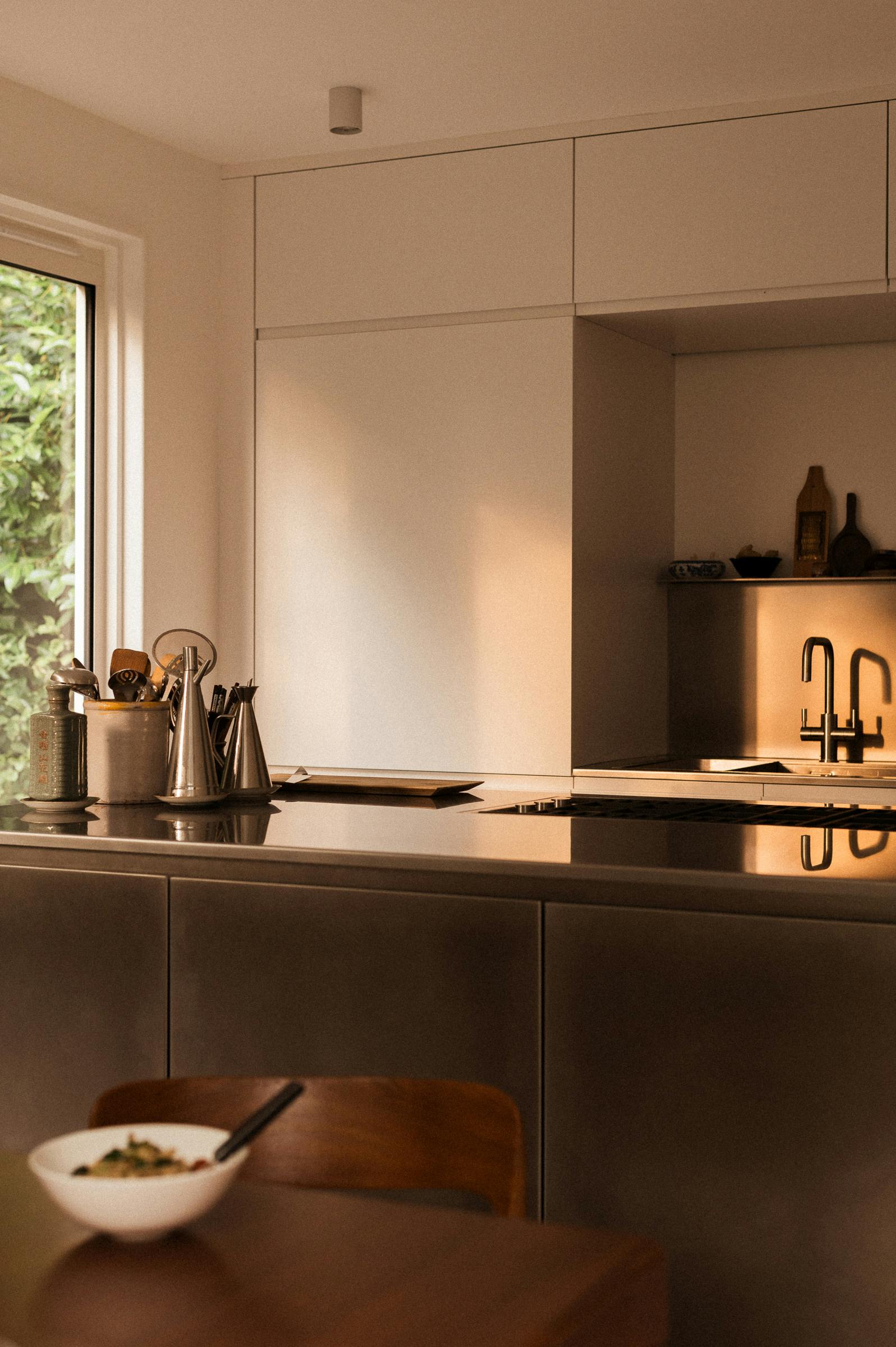 White painted and stainless steel Ma-kon kitchen in Dulwich, South London