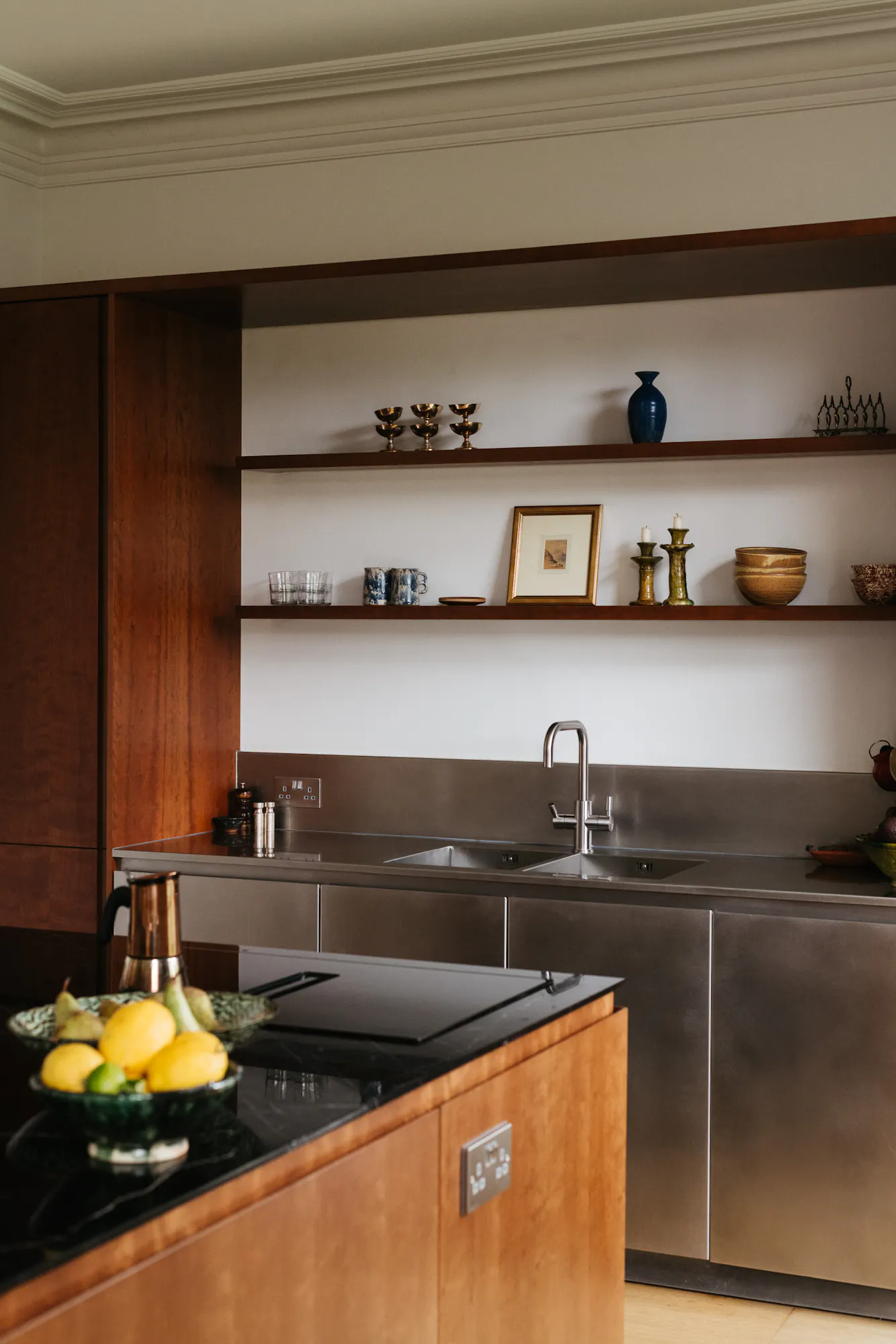 Cherry timber, black marble and stainless steel Ma-kon kitchen.