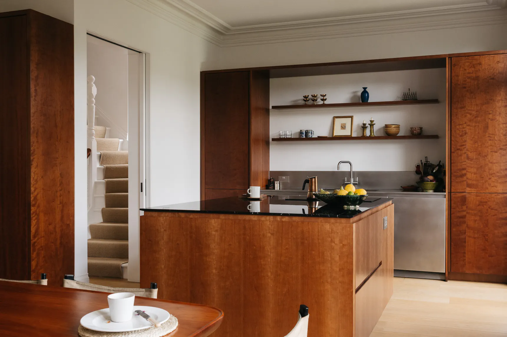Cherry timber, black marble and stainless steel Ma-kon kitchen.
