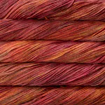 Picture of Malabrigo Vientos Zinnias: Vibrant magenta-pink yarn with subtle coral and deep berry undertones.
