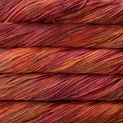Picture of Malabrigo Vientos Zinnias: Vibrant magenta-pink yarn with subtle coral and deep berry undertones.