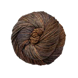 Picture of Malabrigo Rios Capricorn: A richly variegated earthy brown colorway featuring a deep blend of chestnut and cocoa tones, interwoven with dark charcoal shading and subtle hints of golden tan.