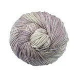 Picture of Malabrigo Rios Cancer: A soft and delicate colorway featuring a gentle blend of pale cream and ivory tones, beautifully variegated with subtle washes of dusty mauve, lavender, and muted rosy pink.