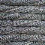 Picture of Malabrigo Torzal Mineral: A subtle, stone-inspired colorway blending heathered slate grey and muted denim blue tones, delicately interwoven with faint earthy hints of sandy beige and charcoal shading.