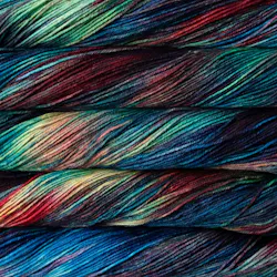 Picture of Malabrigo Arroyo Camaleon: A highly variegated, multi-colored yarn featuring a striking mix of deep teals, forest greens, earthy reds, and vibrant golden yellow highlights.