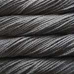 Picture of Malabrigo Vientos Black Forest: A deep, moody charcoal grey colorway with subtle heathered undertones and rich, shadowy dark slate tones