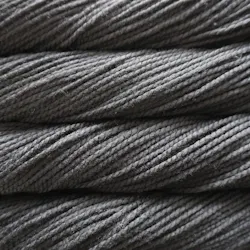 Picture of Malabrigo Vientos Black Forest: A deep, moody charcoal grey colorway with subtle heathered undertones and rich, shadowy dark slate tones