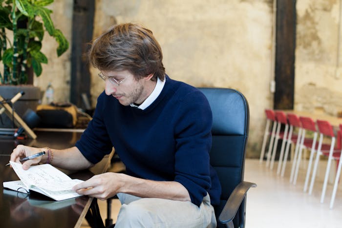 person looking at their notes