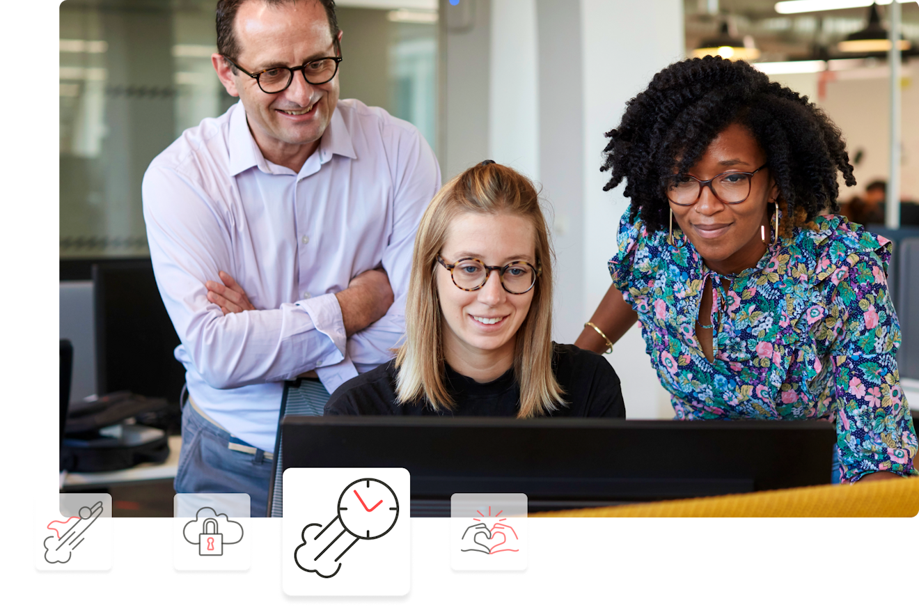 three people looking at a laptop
