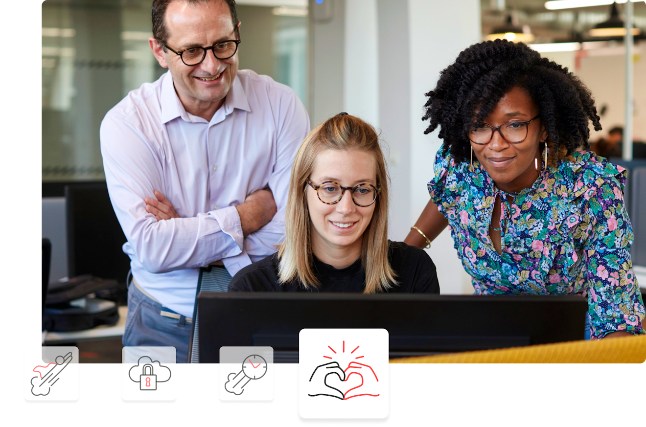 three people looking at a laptop