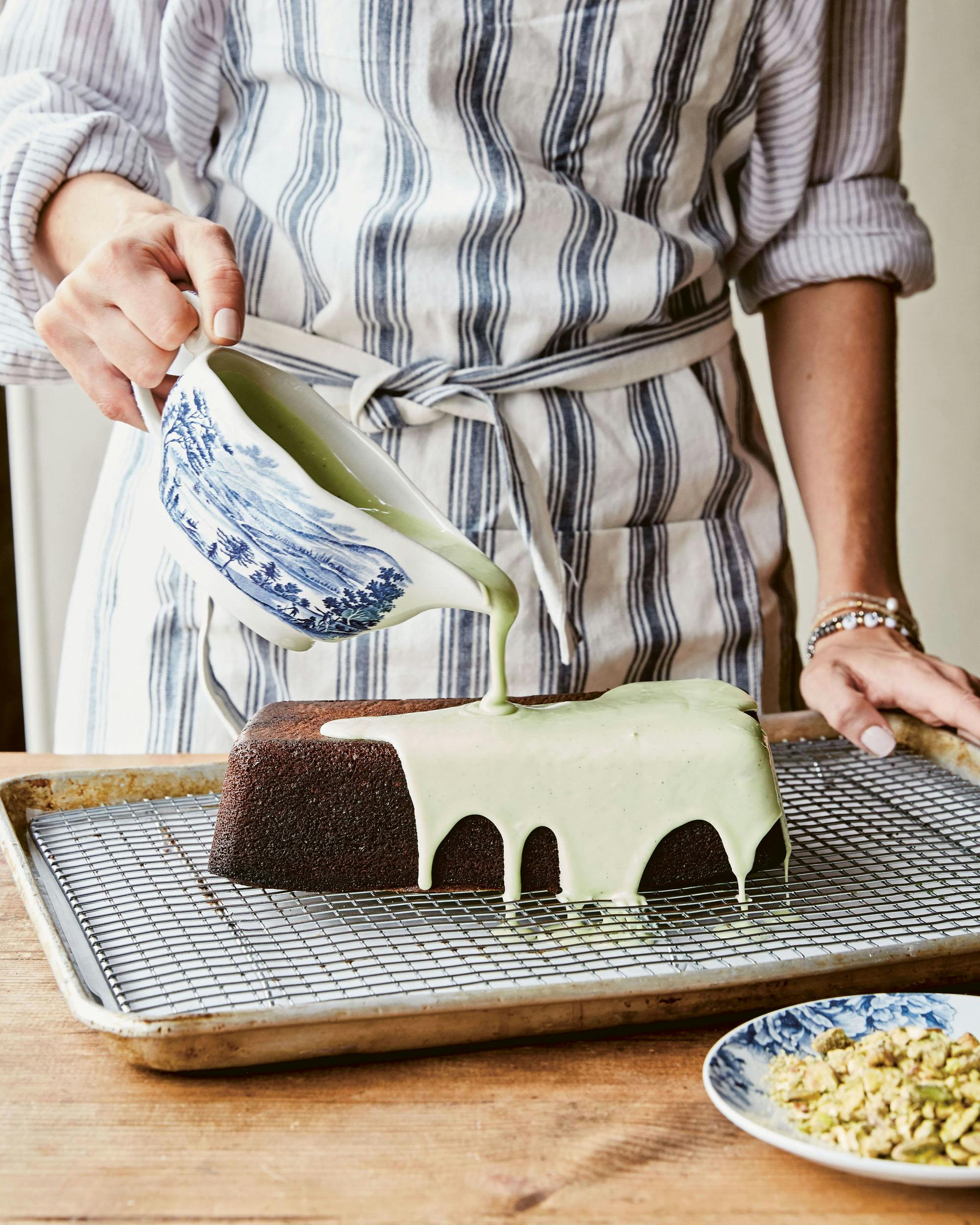 Pouring icing on Pistachio Loaf Cake from maman the cookbook