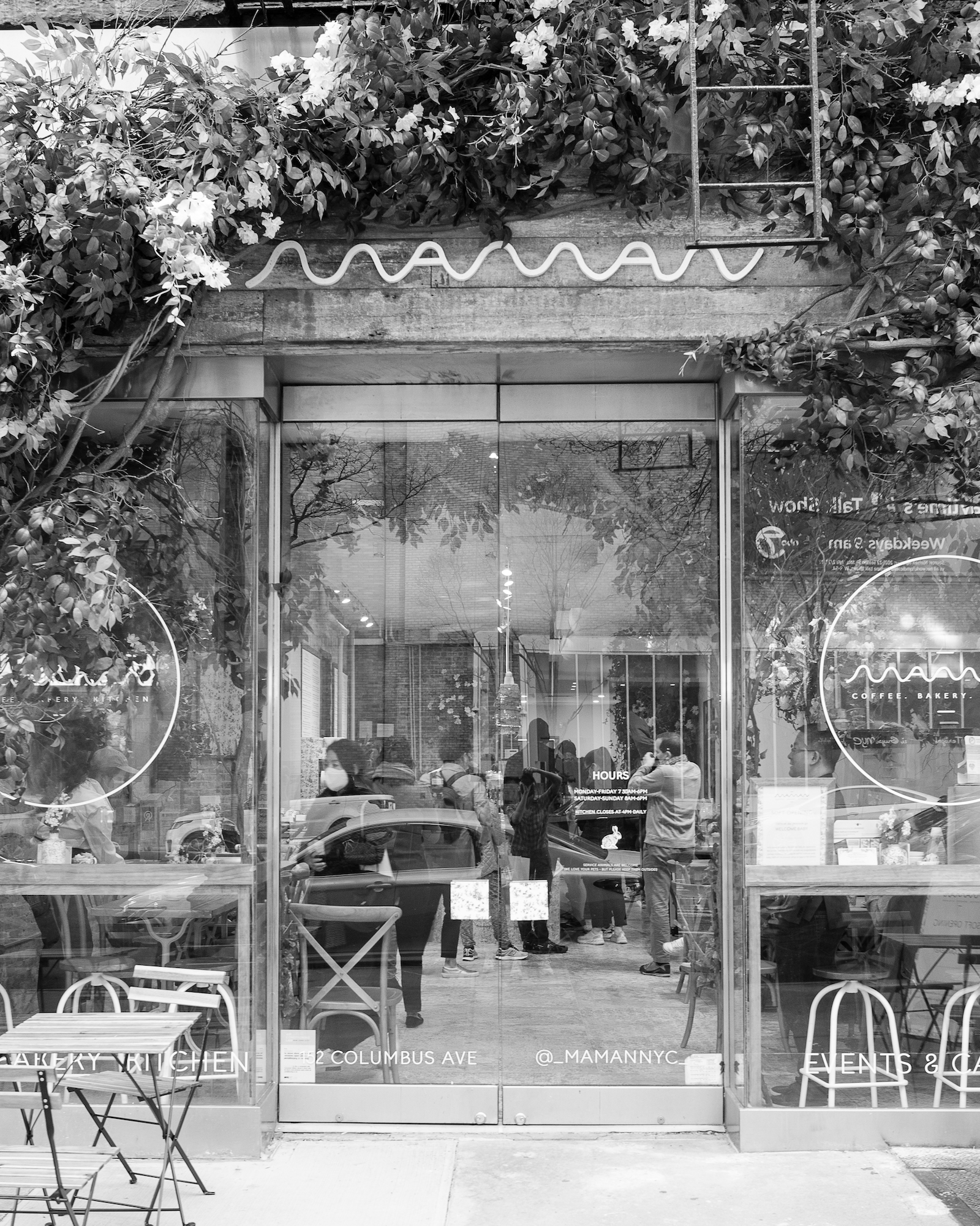 exterior with florals and and maman logo 