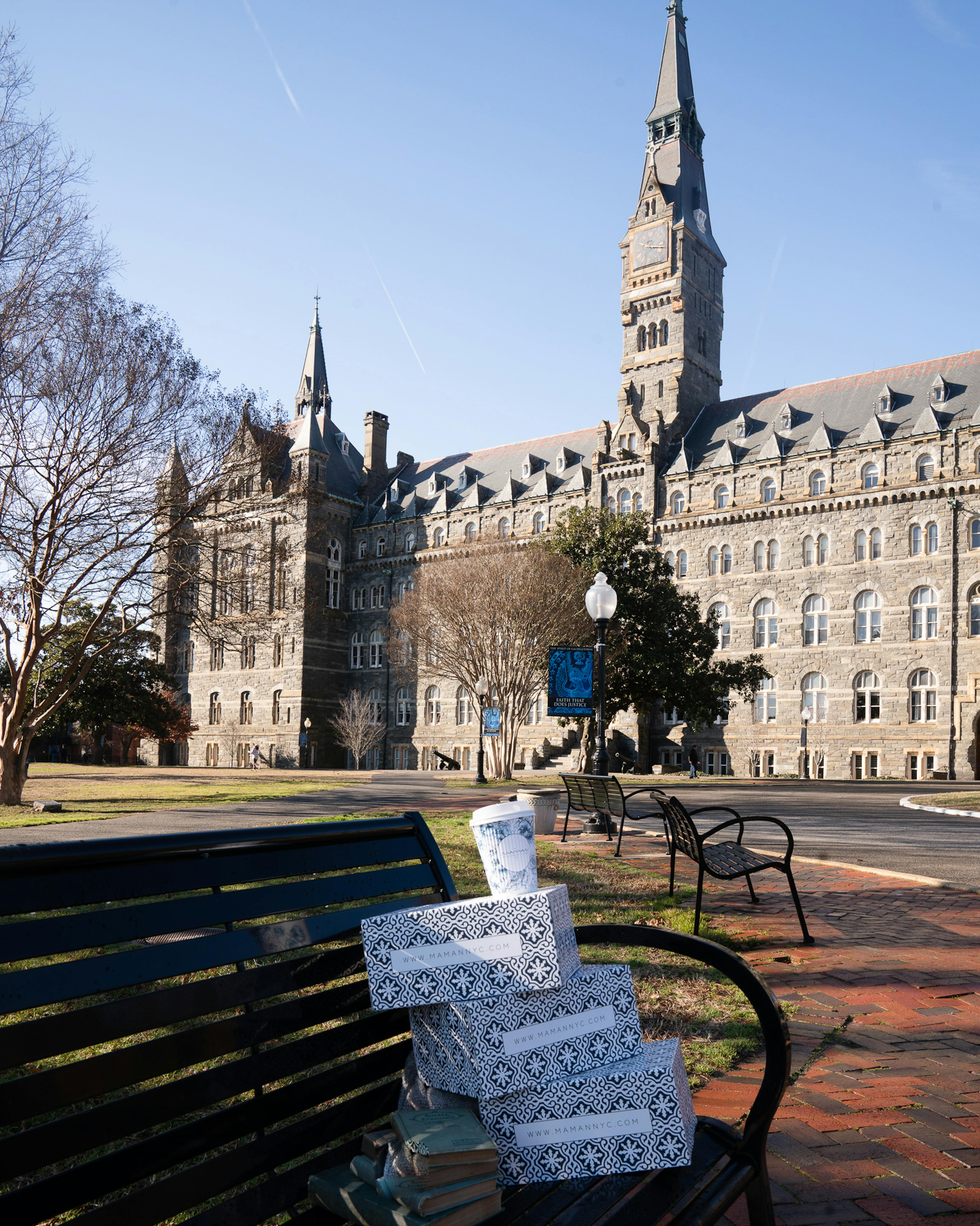 maman cup and boxes on bench outside of georgetown university building