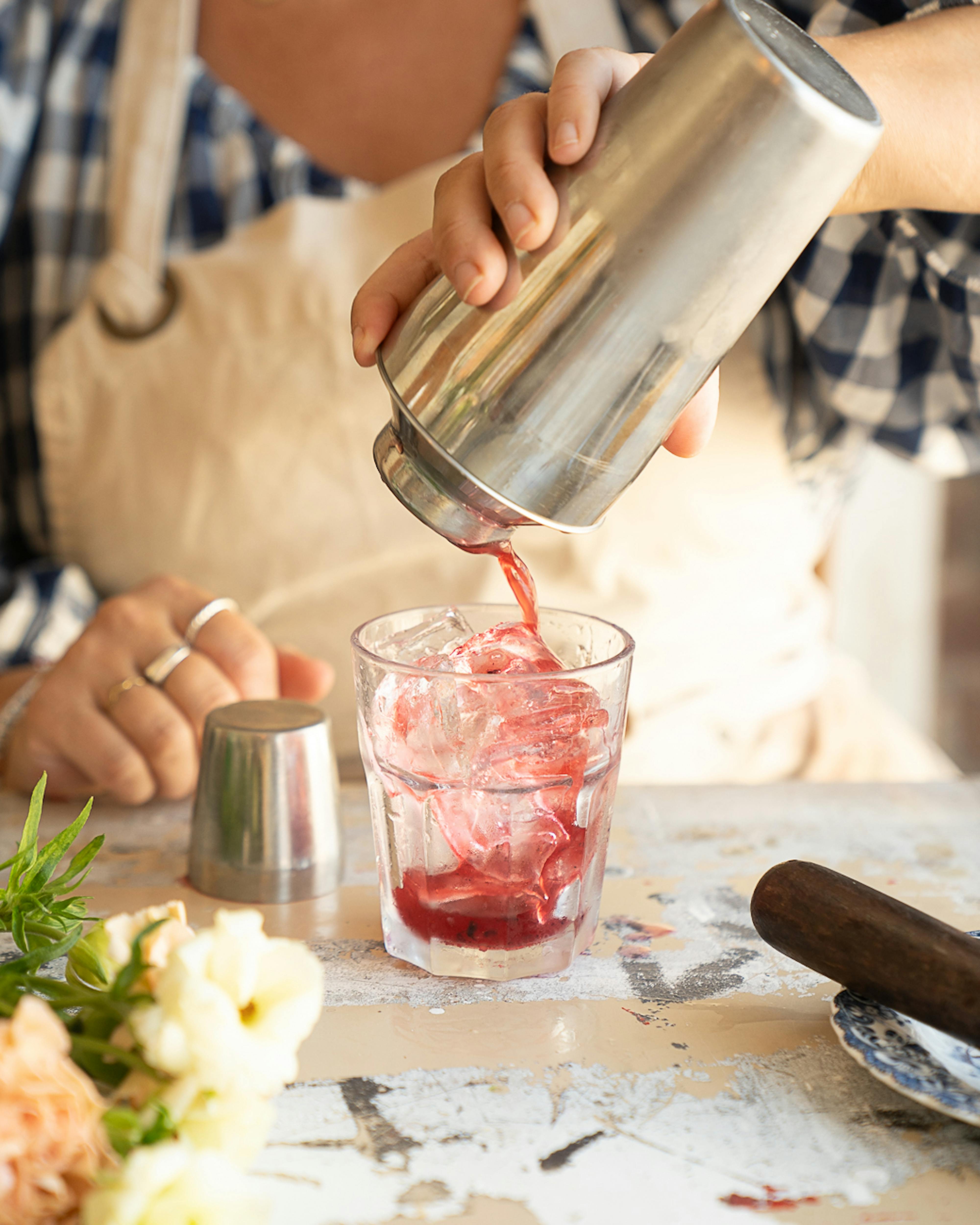 straining liquid into cup