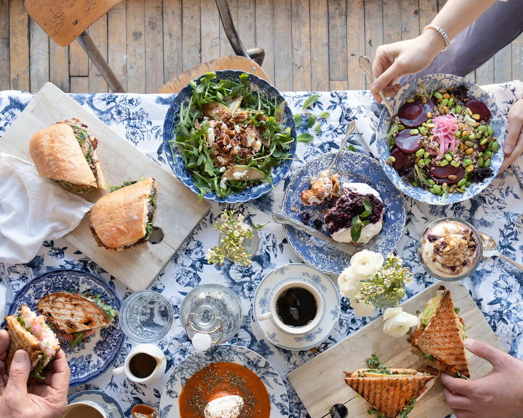 spread of winter sandwiches and salads with coffee