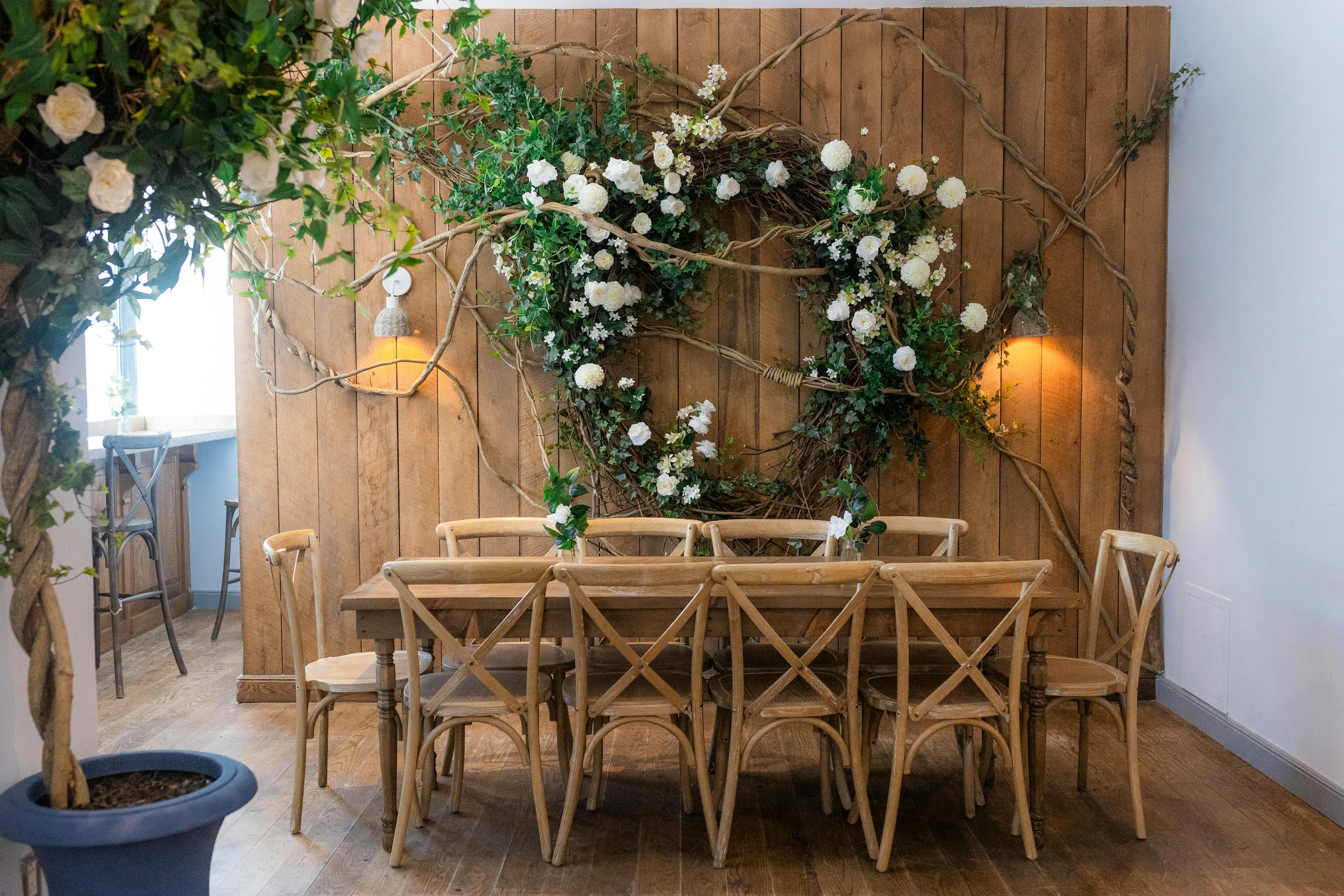 communal table with florals along wall