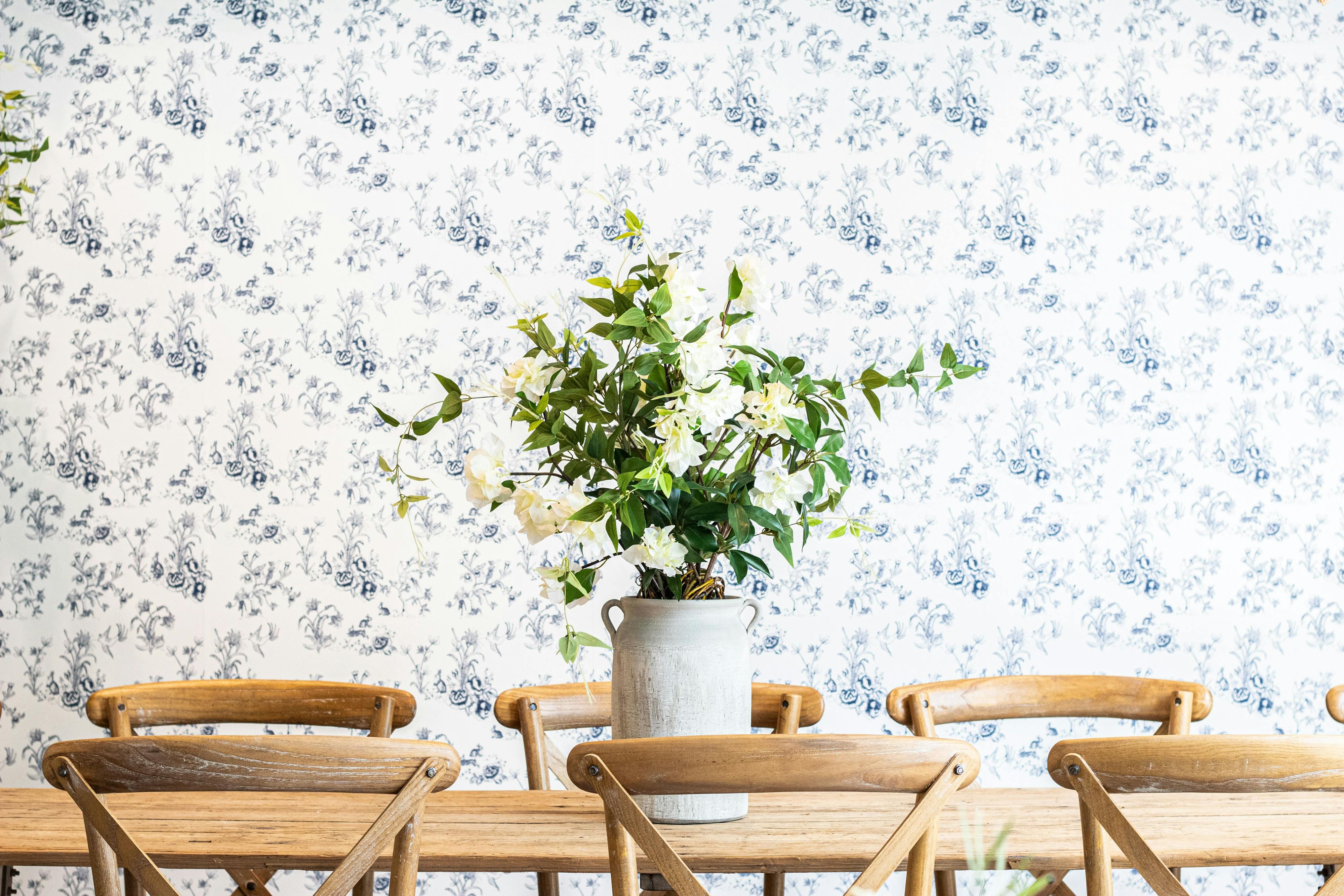 table and chairs with floral display in the center